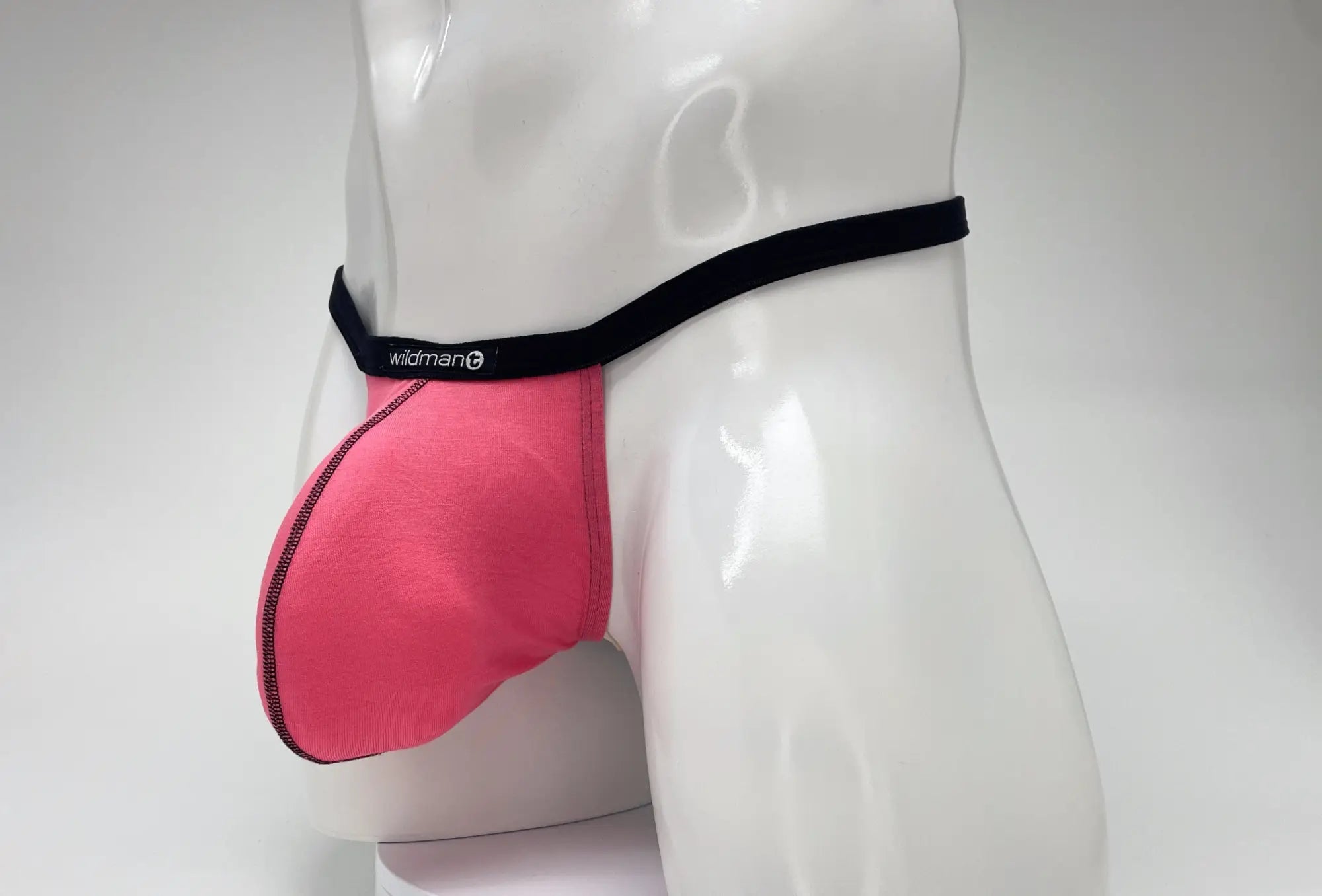 Pink wildman men’s supportive modal micro thong briefs with black waistband and big boy pouch for comfortable fit