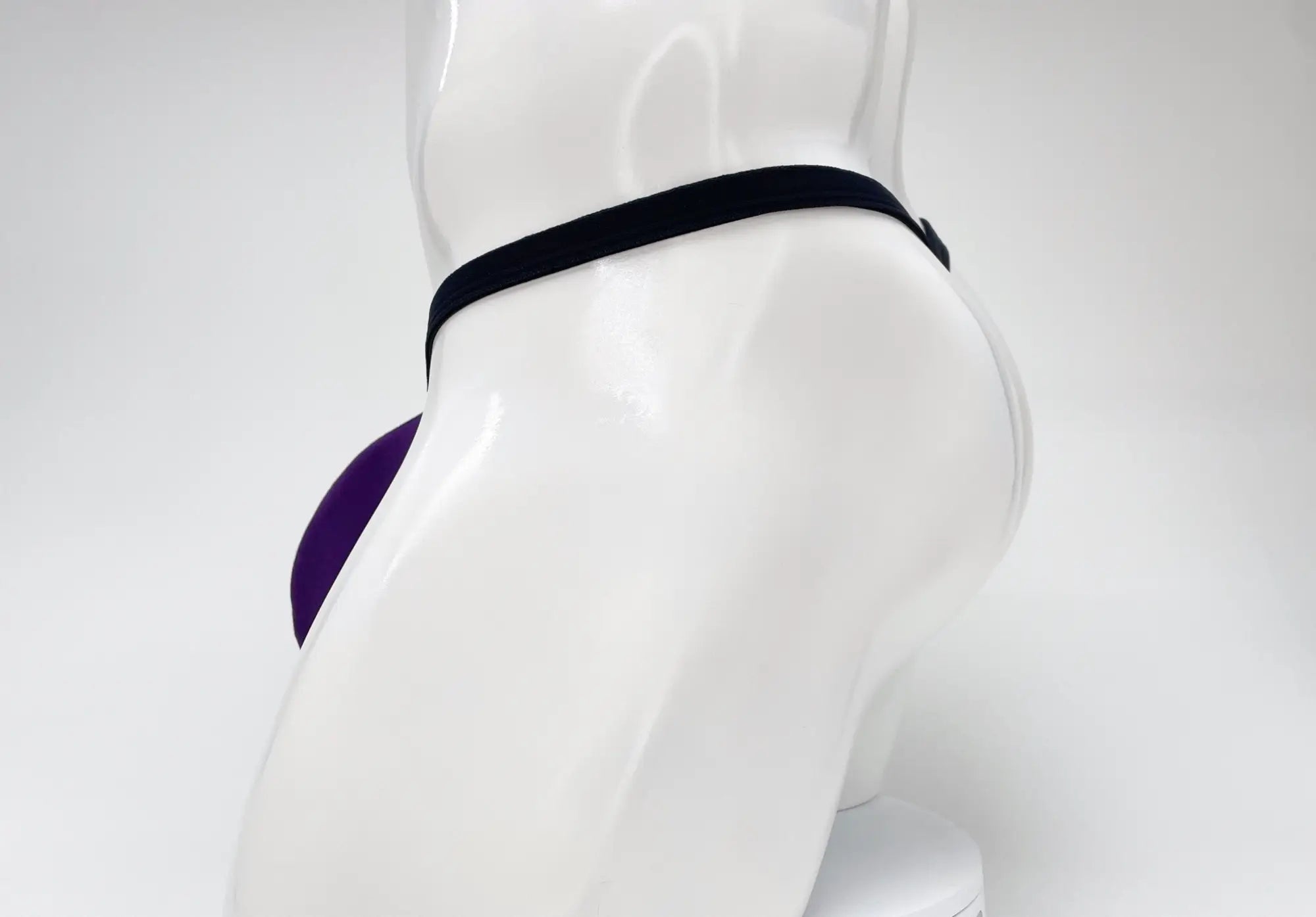 Wildmant modal micro thong big boy pouch in purple and black with sleek form-fitting athletic design