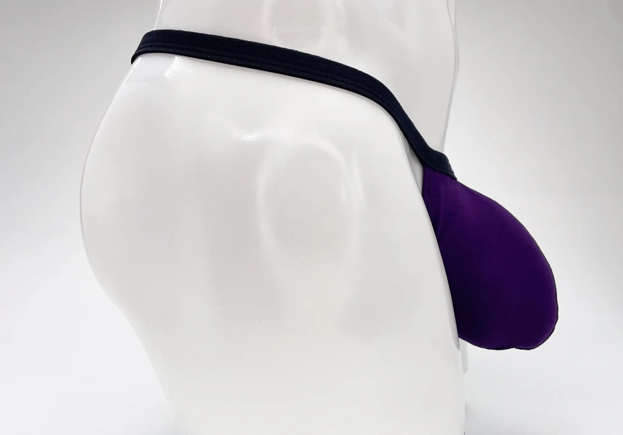 Purple and black wildmant modal micro thong big boy pouch jockstrap with supportive contoured design