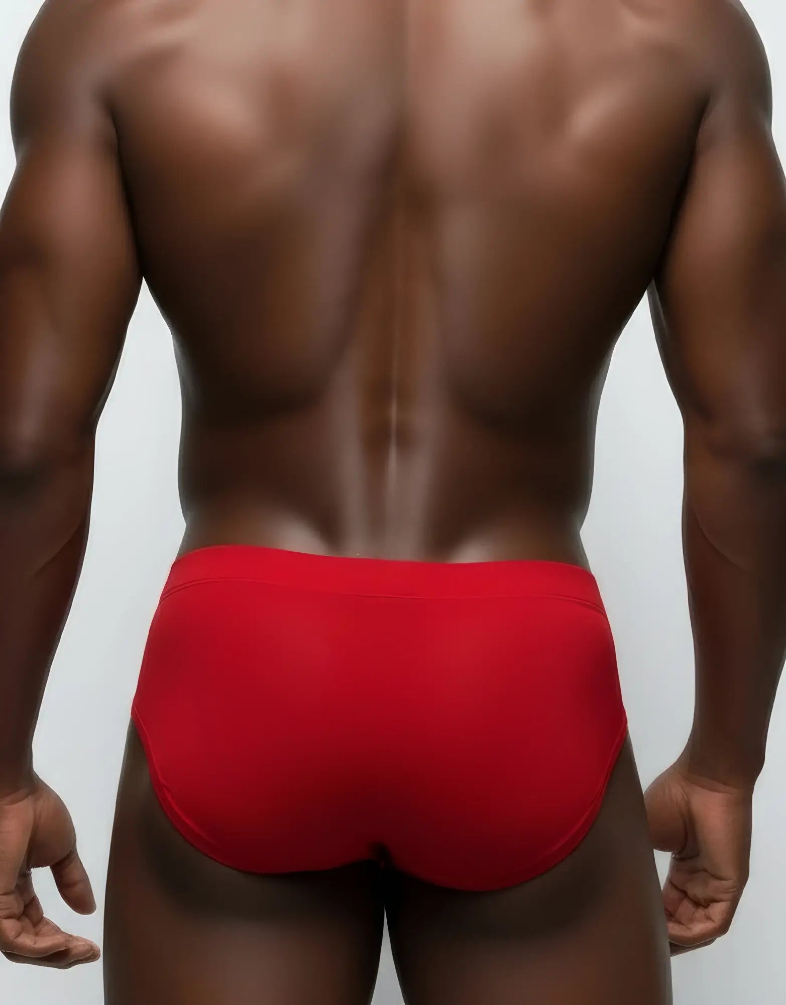 Wildmant monster cock pouch red mesh briefs featuring smooth form-fitting fabric for athletic support