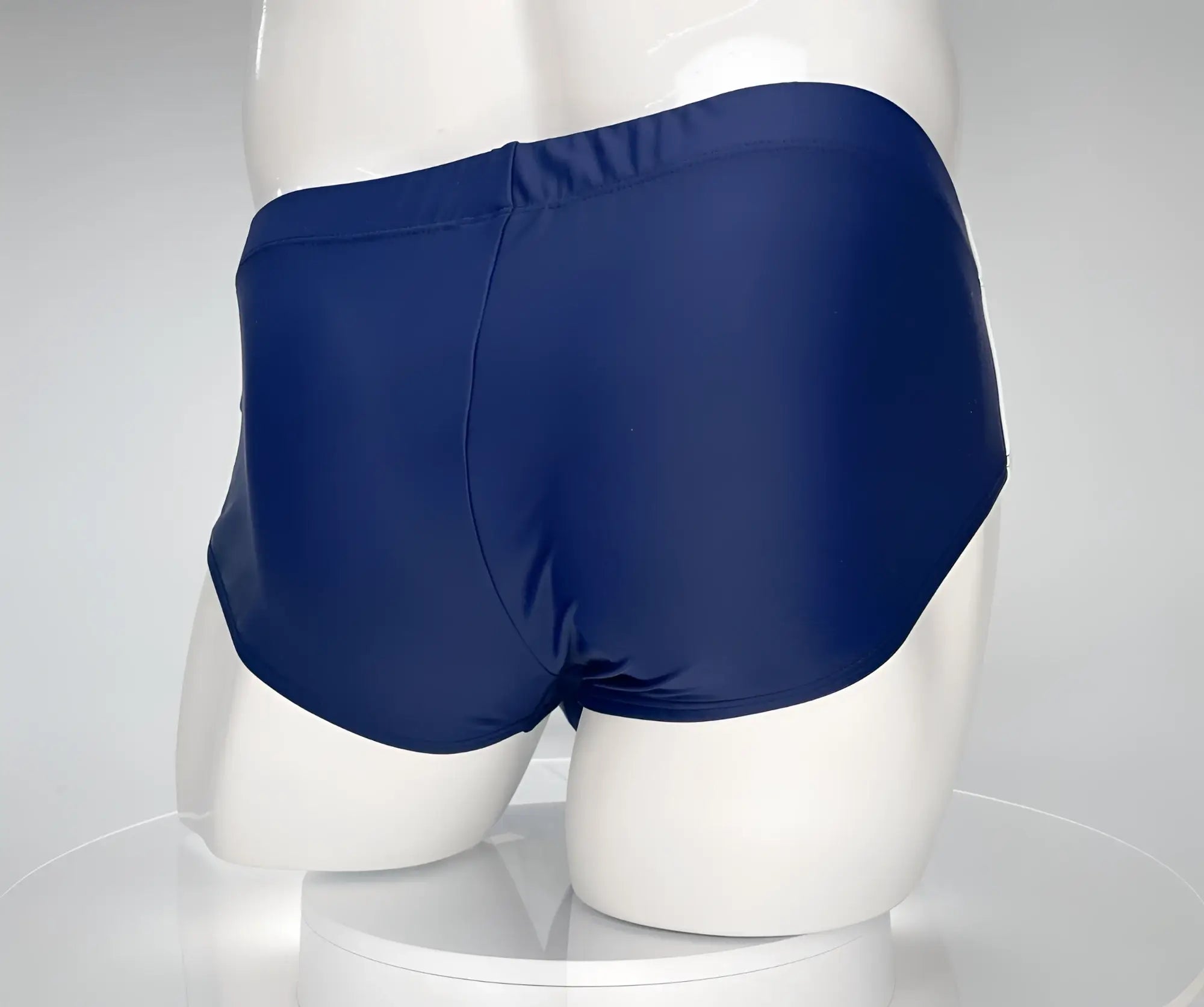 Navy blue WildmanT Monster Cock swim brief made of smooth glossy fabric for comfortable swimwear use