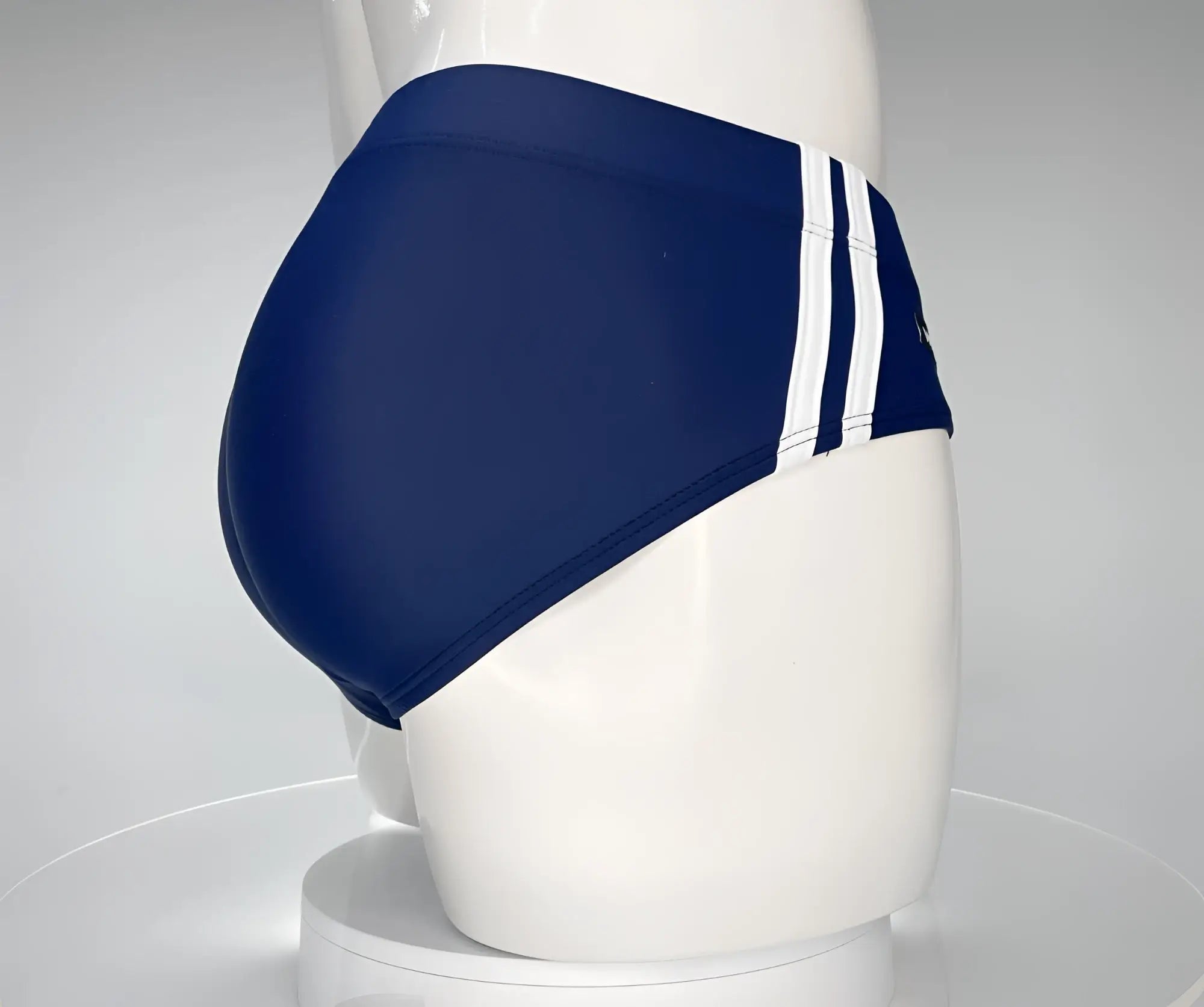 WildmanT Monster Cock swim brief navy blue with three white vertical stripes on the side for swimming