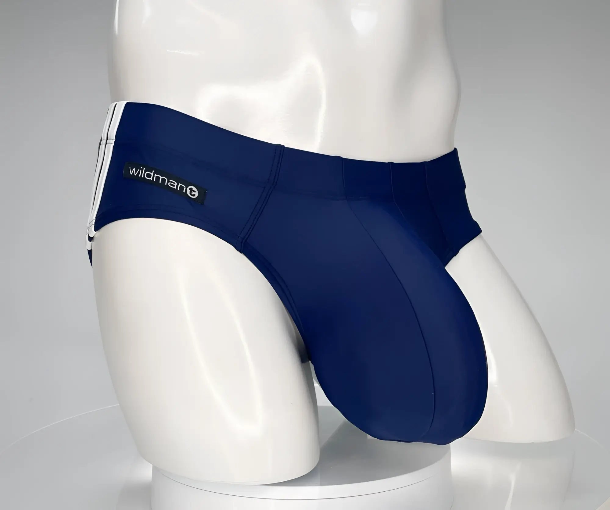 Navy wildman swim trunks with white side stripes designed for active beach and pool use