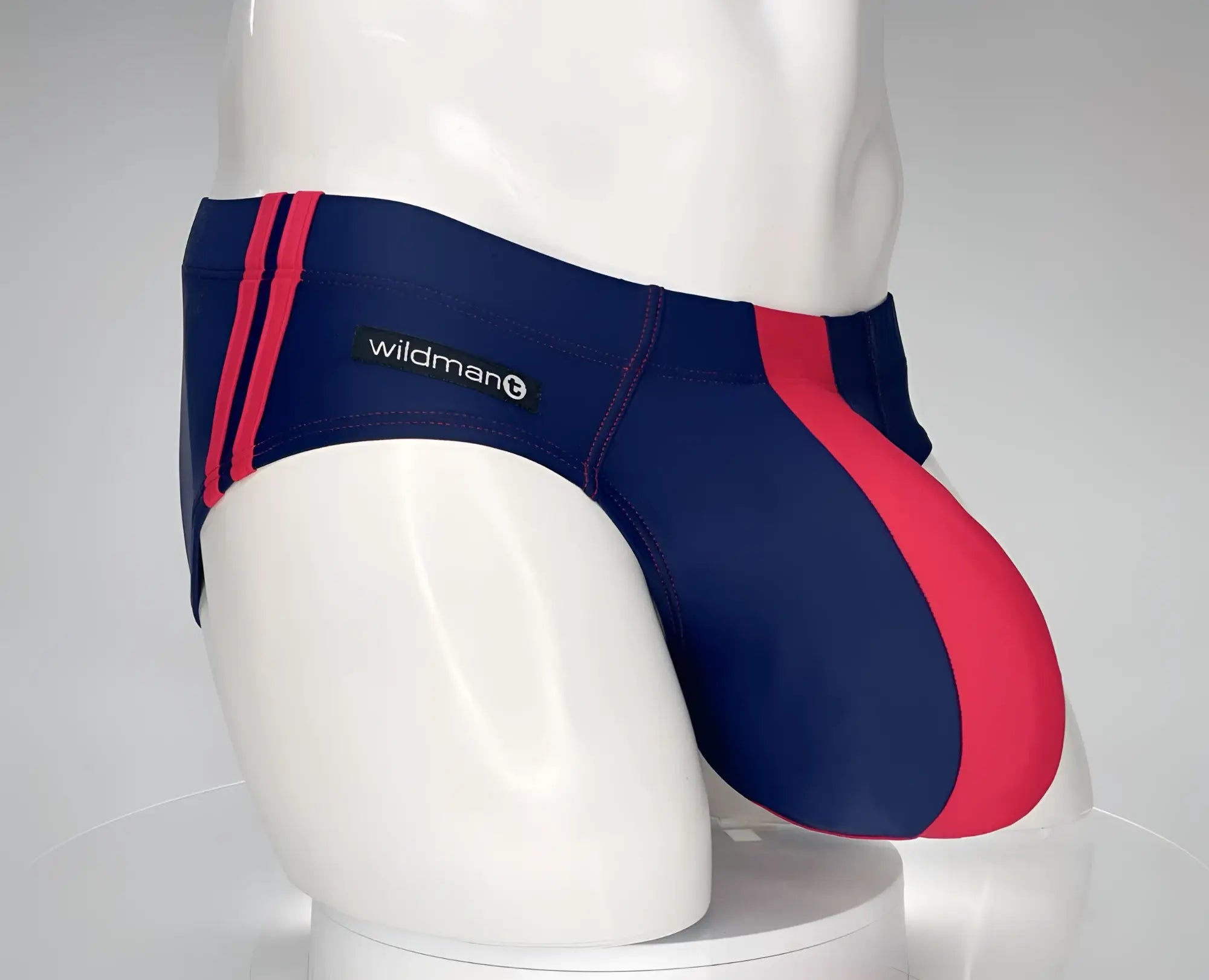 Wildmant monster cock swim brief in navy and red features a sleek form-fitting design for athletic swimming