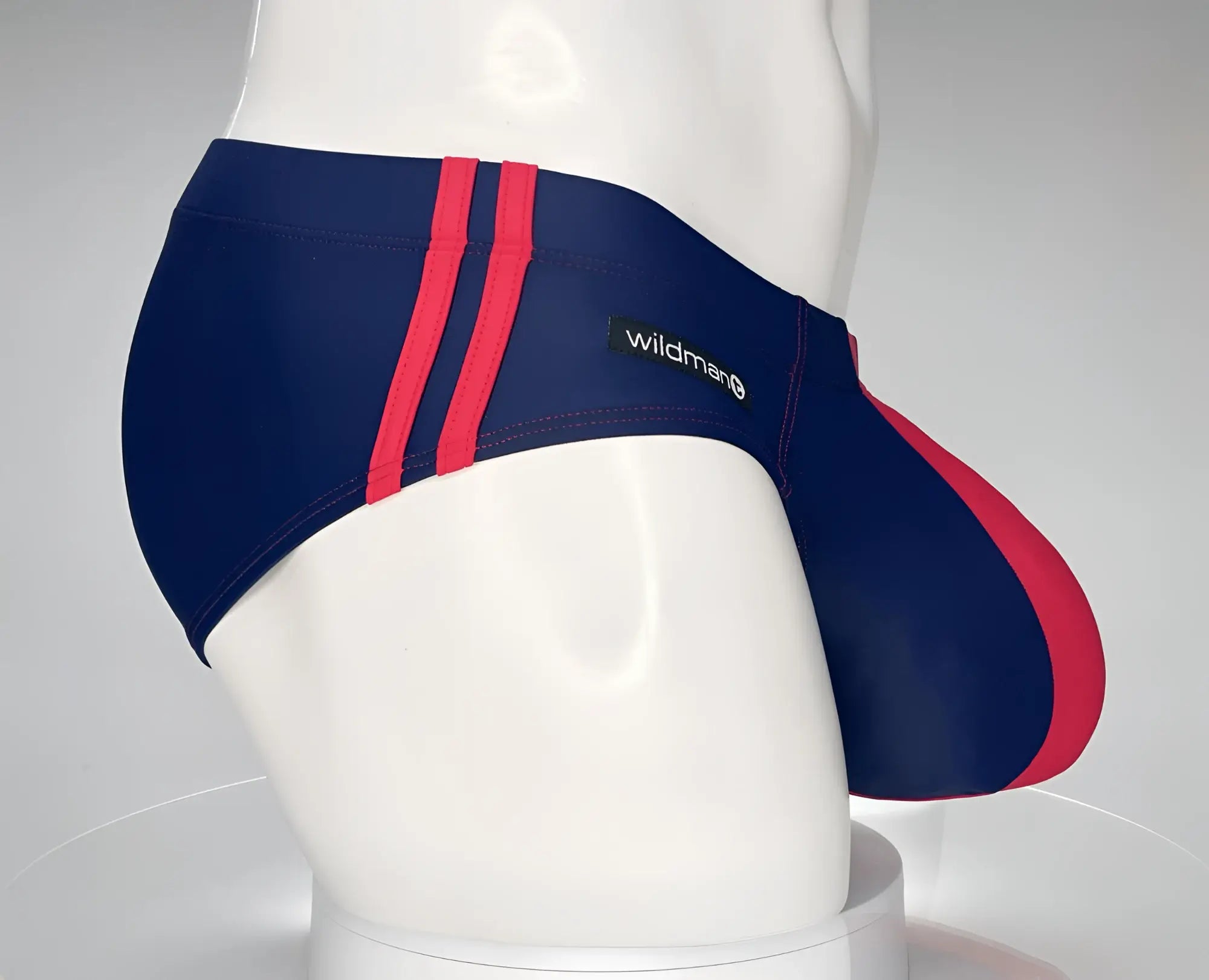Navy blue and red striped Wildman swim briefs with brand label designed for swimwear use