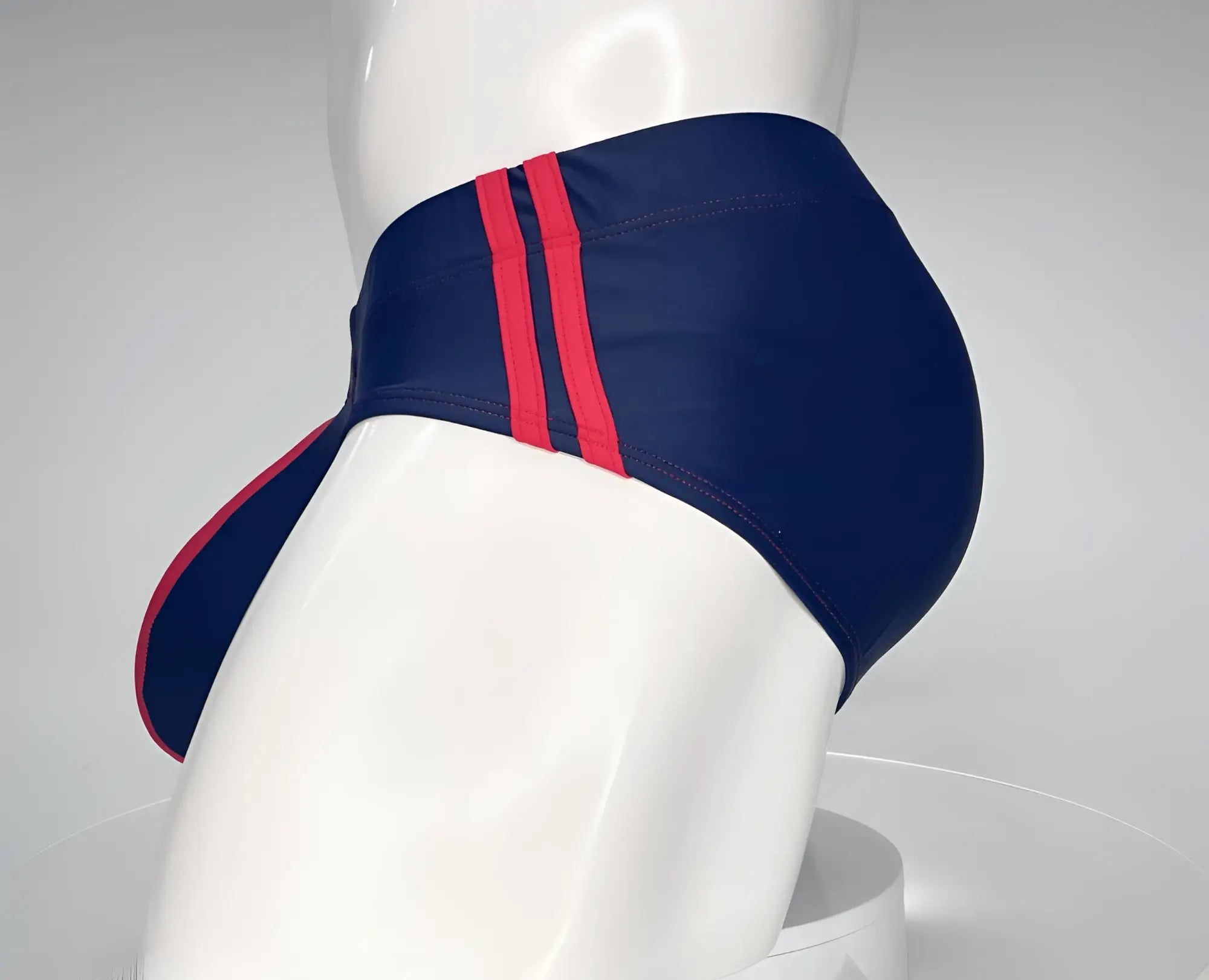 Wildmant monster cock swim brief navy with bold red side stripes designed for swimwear use