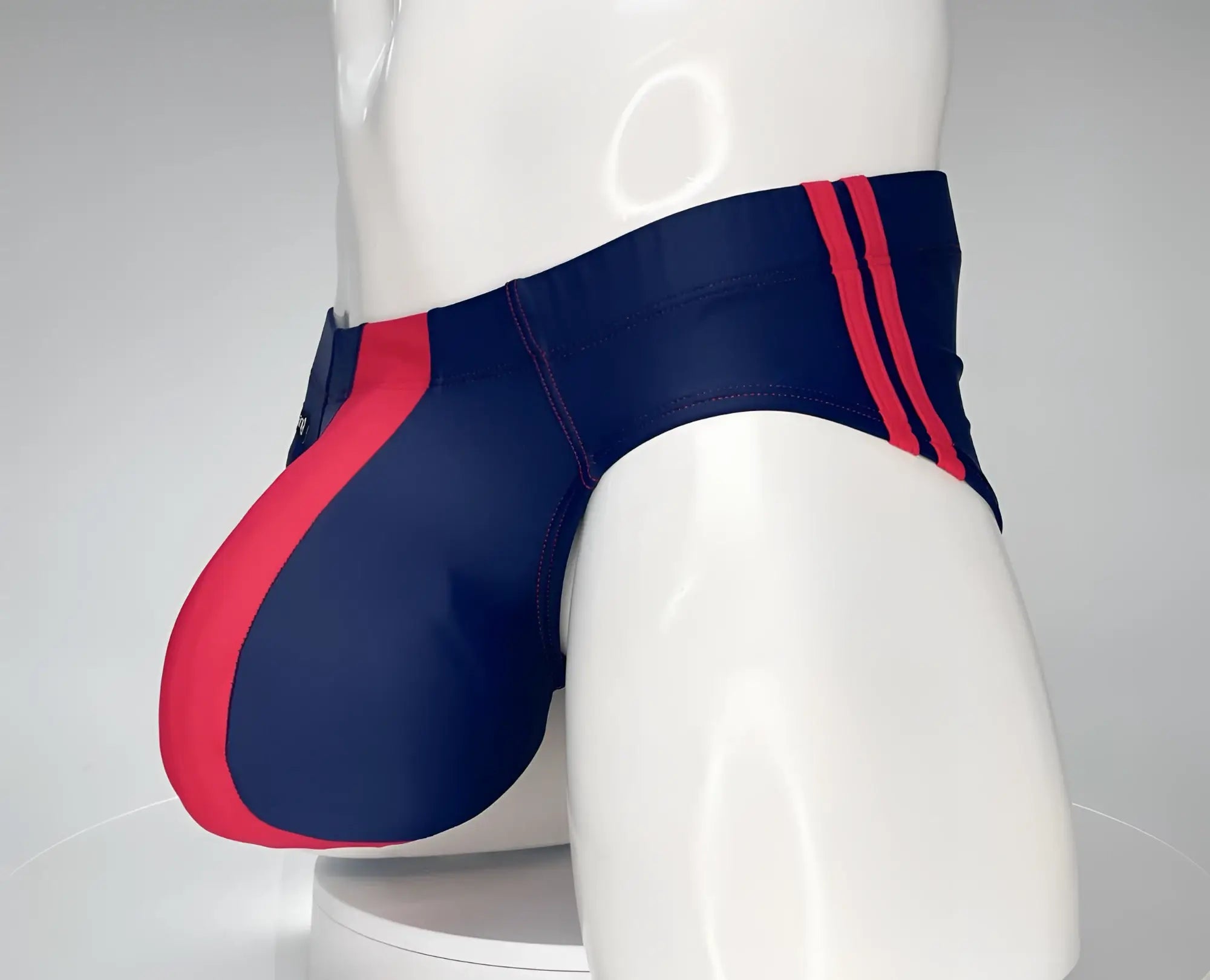 Wildmant monster cock swim brief navy red with bold red side panels and matching vertical waistband stripes