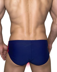 WildmanT Monster Cock swim brief in navy blue with red side panels designed for comfortable swimwear use