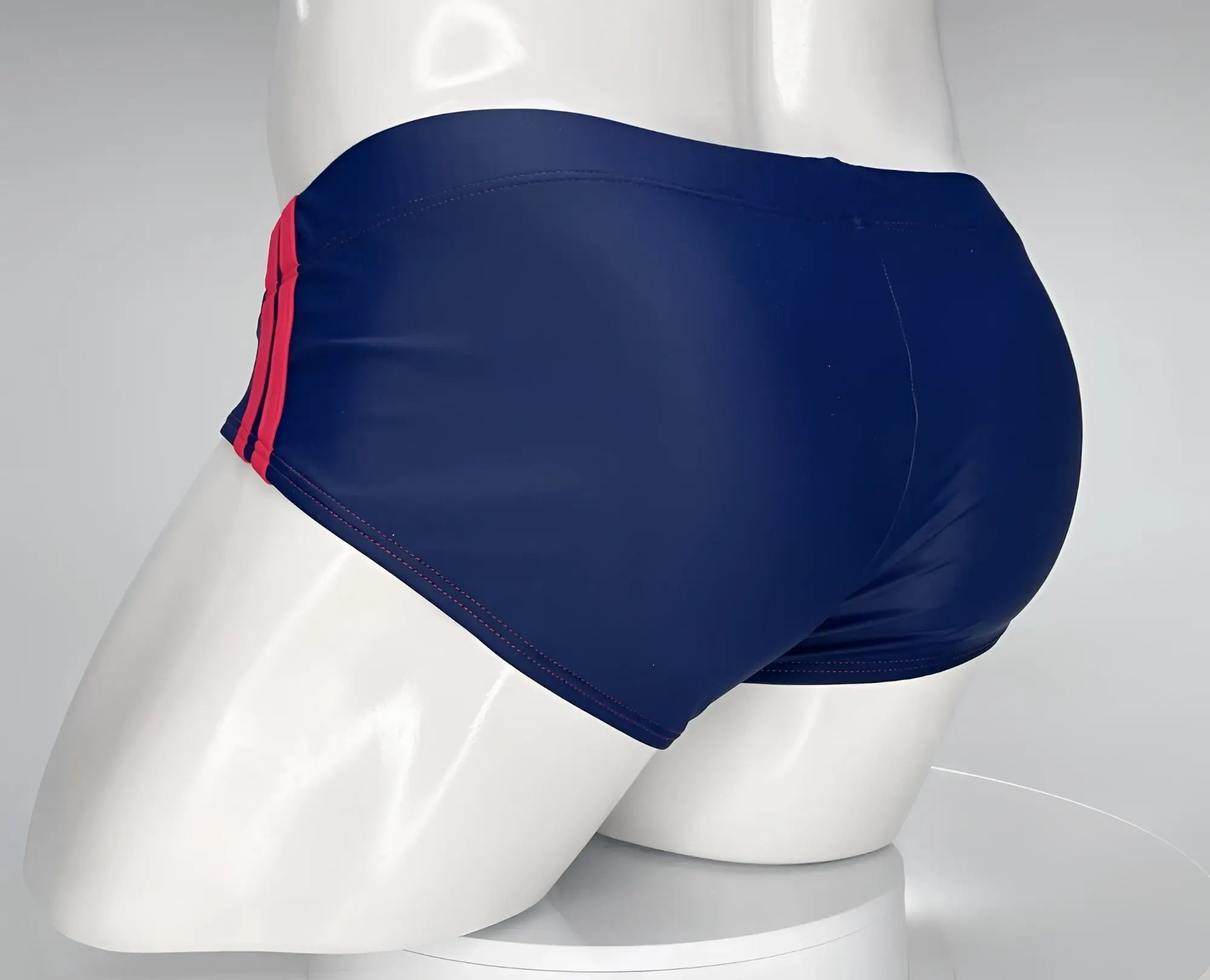 Wildmant monster cock swim brief navy with red side stripes features navy blue swim trunks designed for performance and style