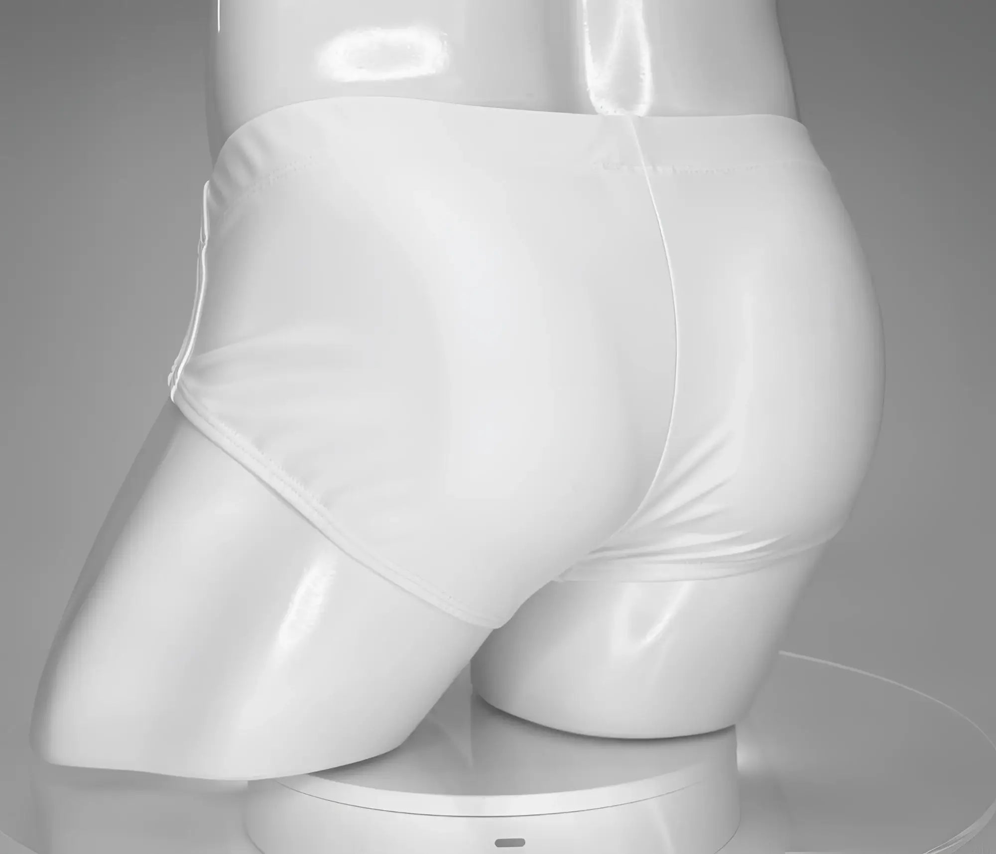White glossy swim briefs by wildmant featuring a monster cock design displayed on a mannequin front view