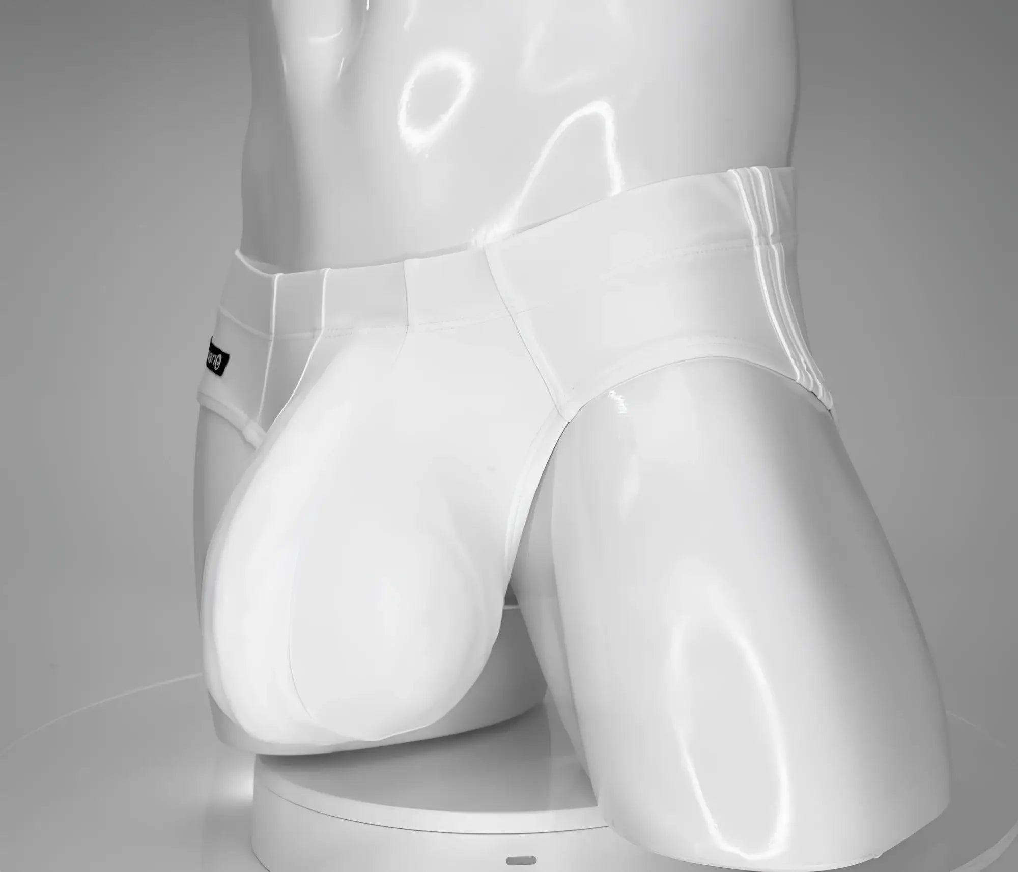 White glossy wildmant monster cock swim brief with sleek form fitting design and subtle stitching details