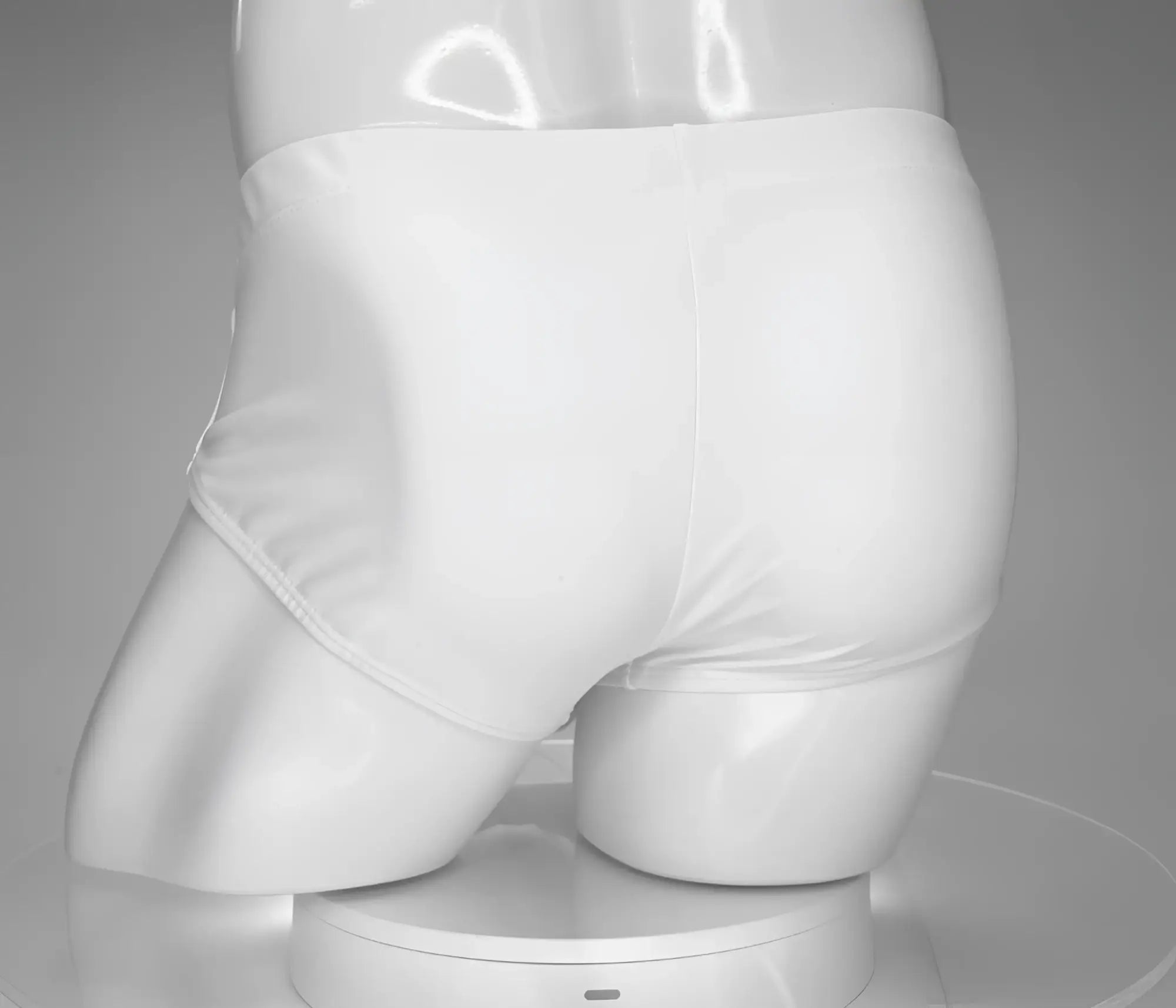 White briefs swim brief by wildmant with monster cock design displayed on a mannequin front view