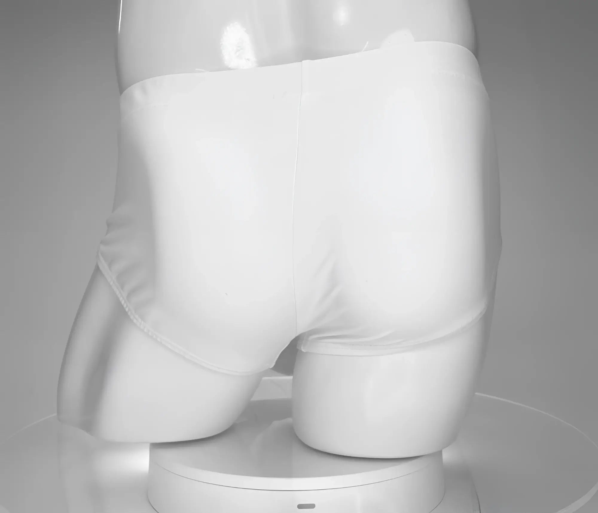 White briefs swim brief by wildmant featuring monster cock design in white displayed on a mannequin