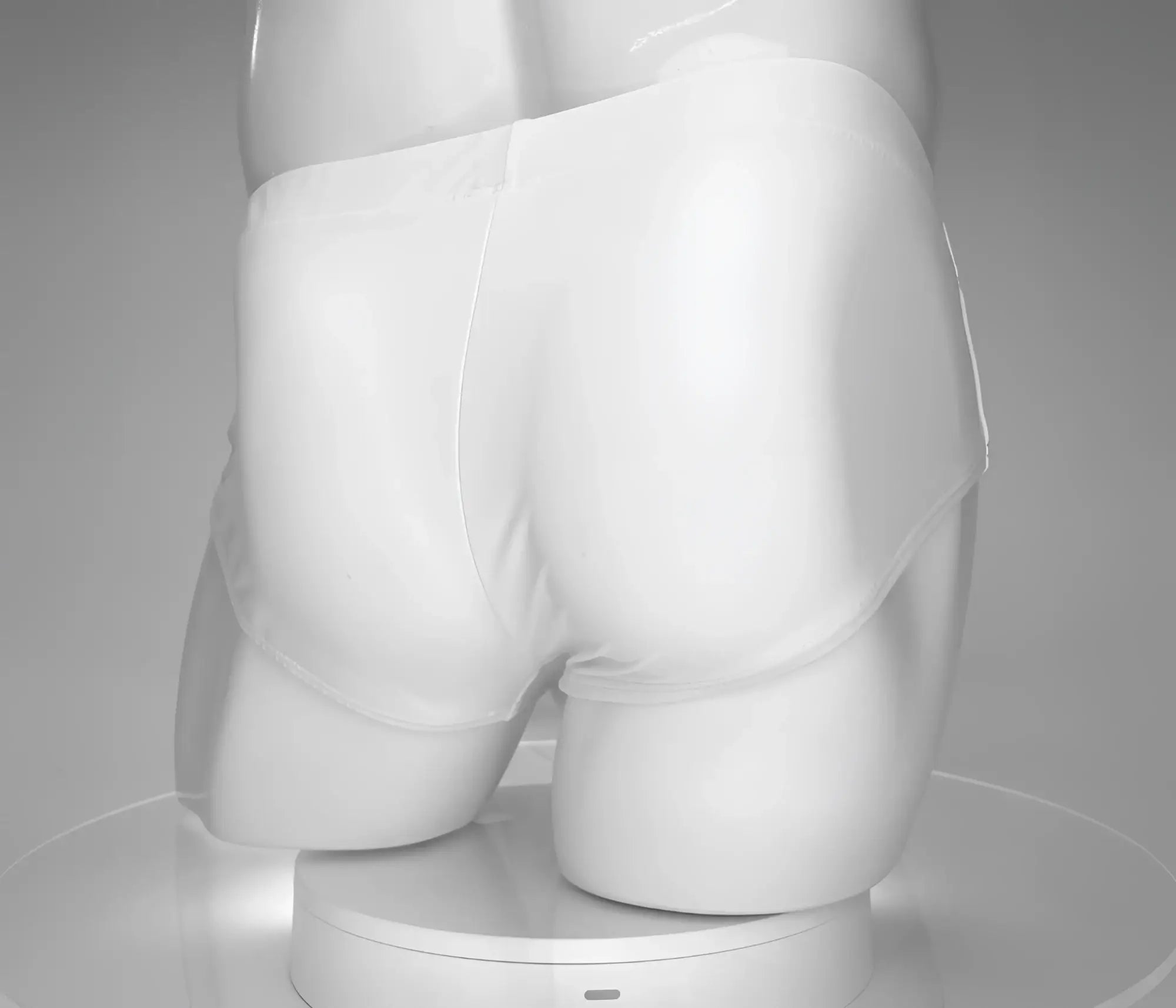 White briefs swim brief by wildmant in white displayed on a mannequin featuring a bold monster cock design