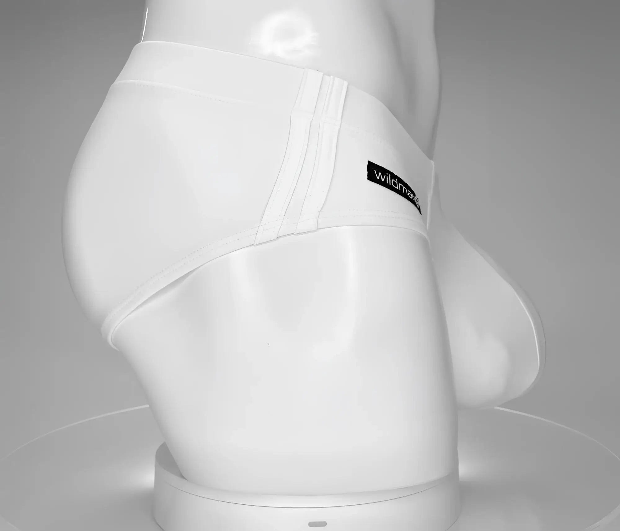 Wildmant monster cock swim brief white with sleek form-fitting design and subtle vertical stitching detail