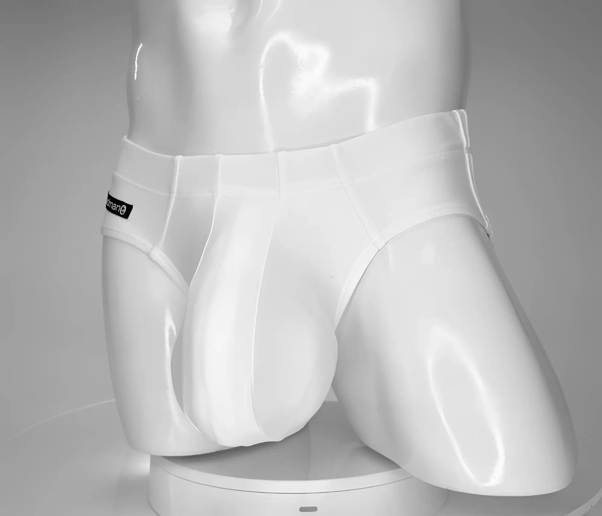 Wildmant monster cock swim brief white men’s briefs with sleek form-fitting design and subtle brand tag on waistband
