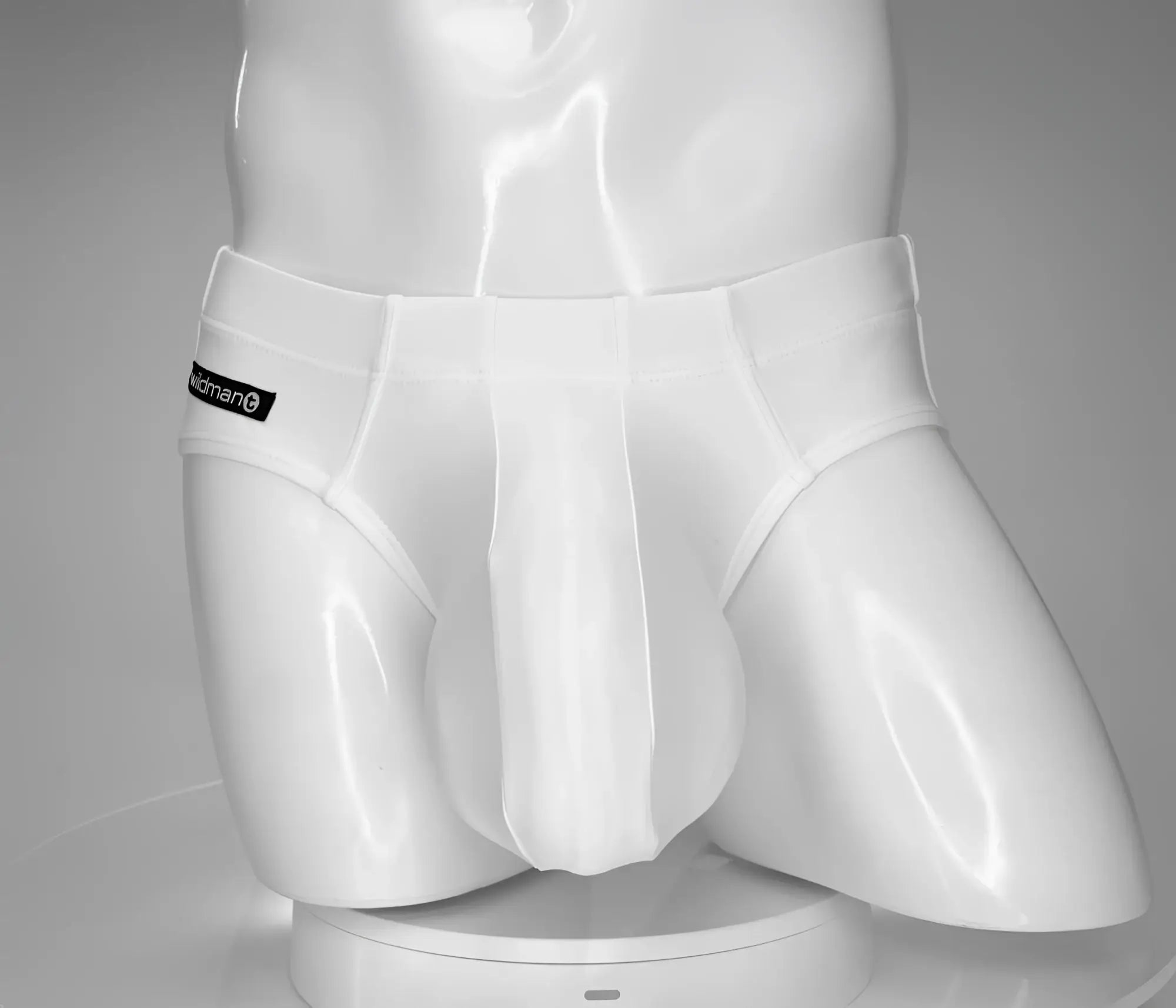 Wildmant monster cock white men’s briefs with sleek form-fitting design and subtle waistband brand label