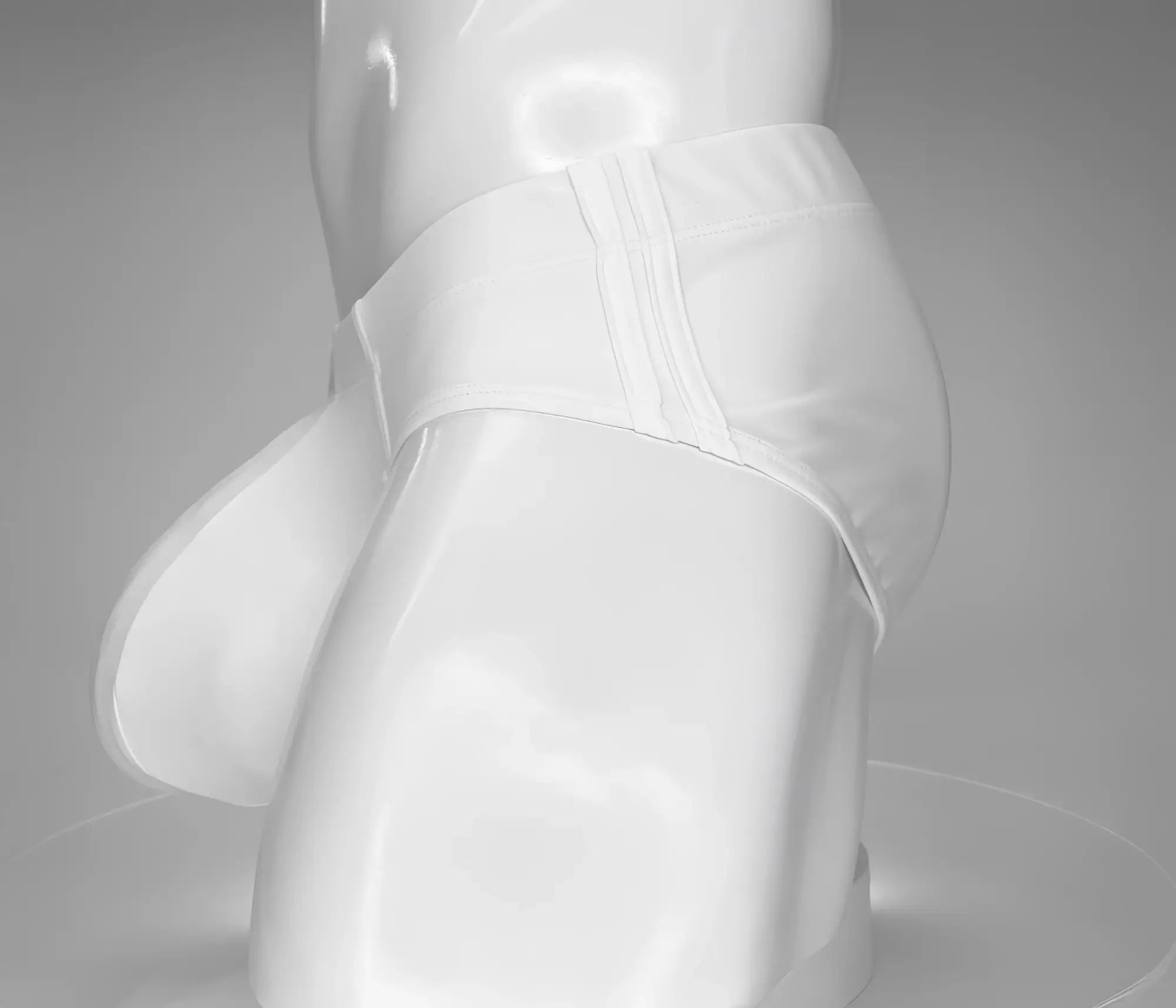 Wildmant monster cock swim brief white satin-like fabric with smooth glossy finish and subtle vertical seam detailing