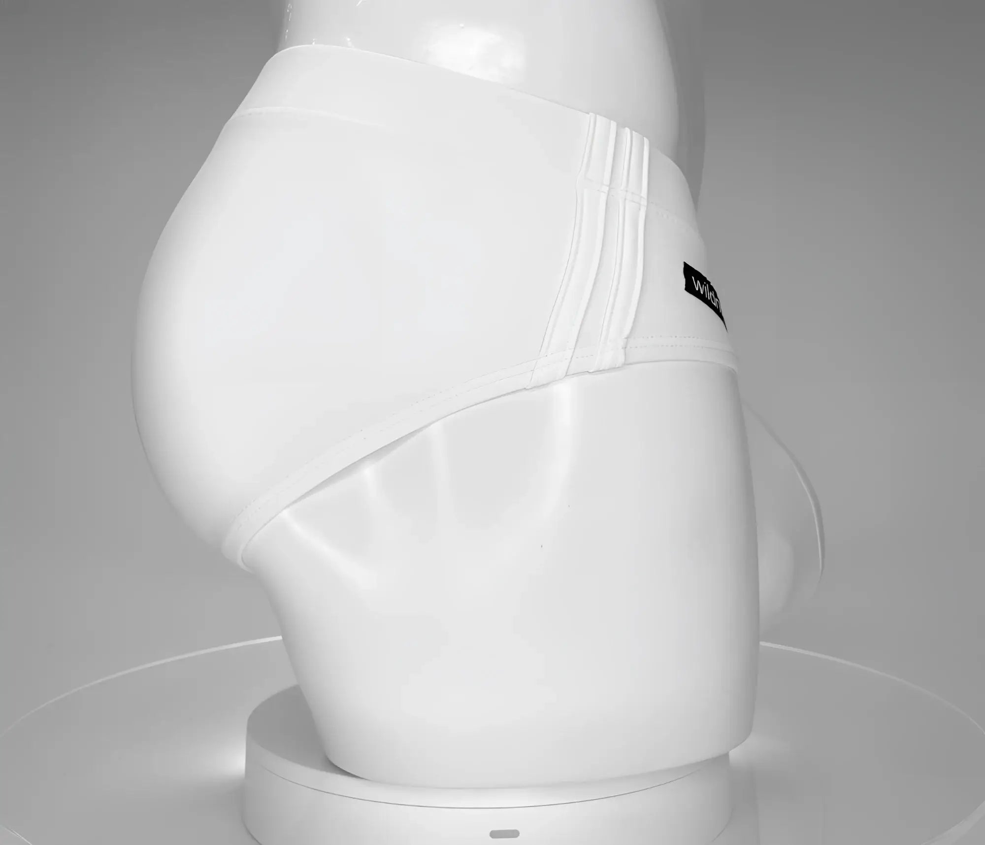 Wildmant monster cock swim brief white with sleek form fitting design and subtle vertical stitching on the side