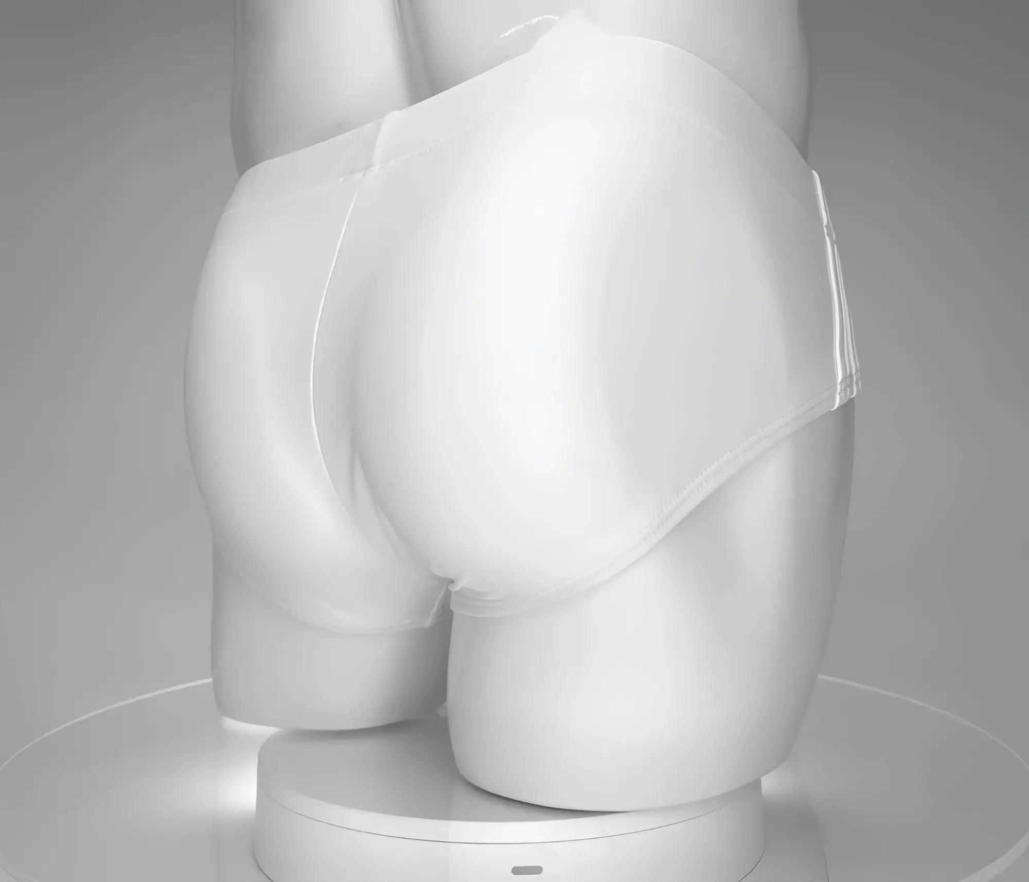 Wildmant monster cock swim brief white smooth textured swim briefs displayed on a mannequin front view