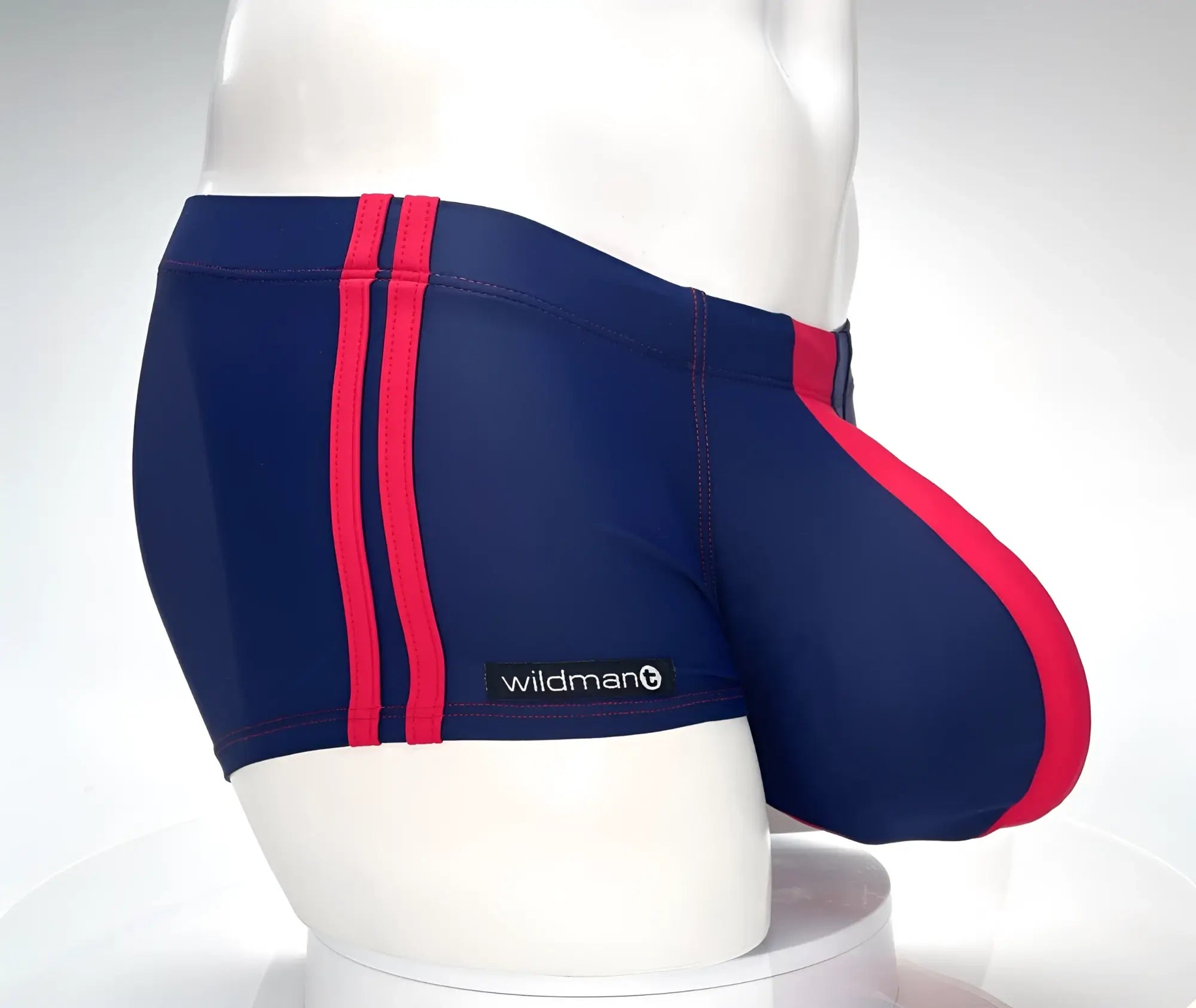 Navy blue wildmanT monster cock swim square cut trunks with bold red stripes and branded label for swimming