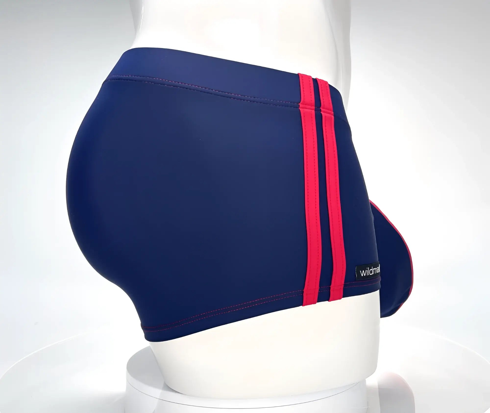 Navy blue swim square cut trunks with bold red stripes and subtle wildman brand label for beachwear use