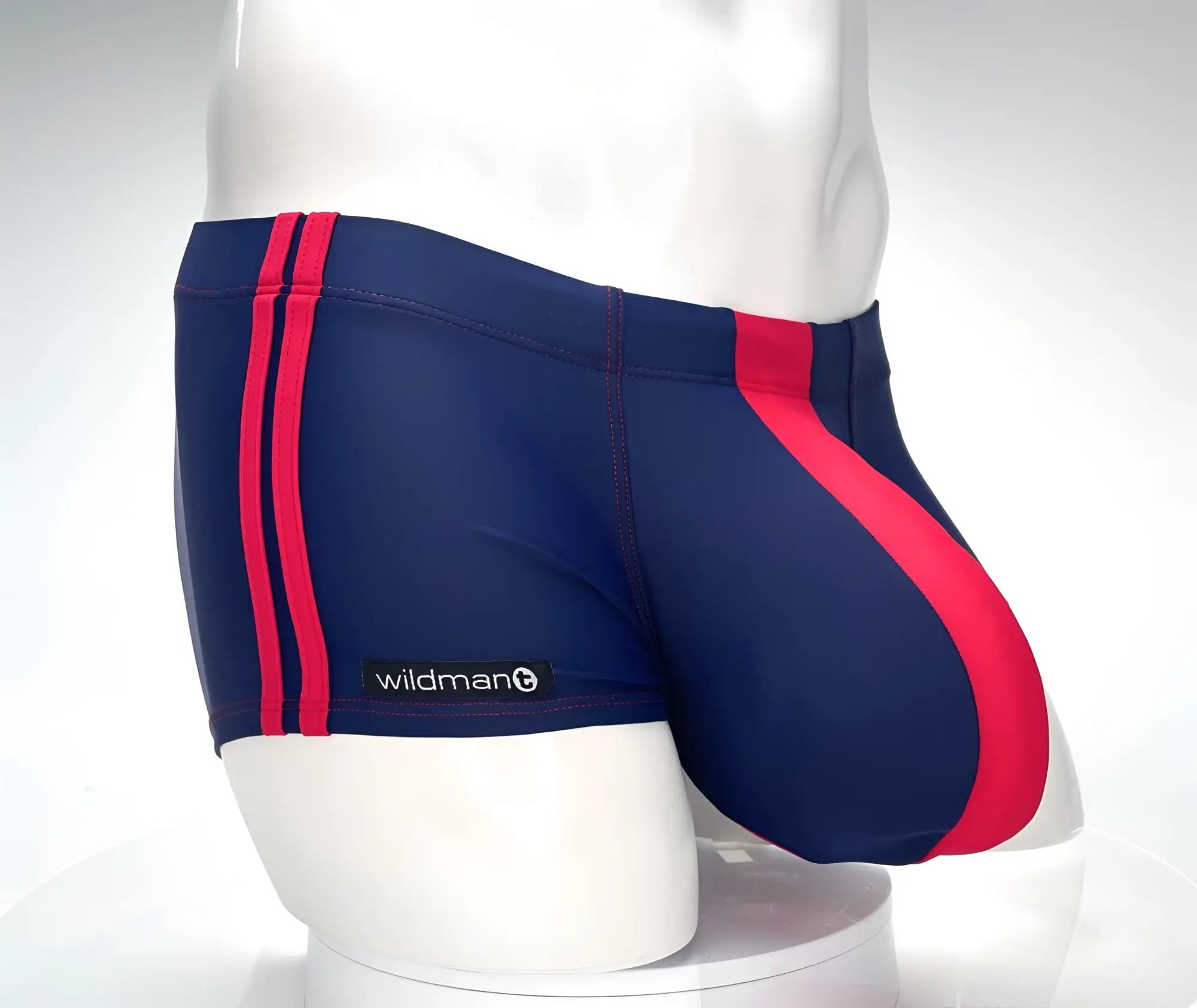 Navy blue WildmanT Monster Cock swim square cut trunks with bold red side and diagonal leg stripes
