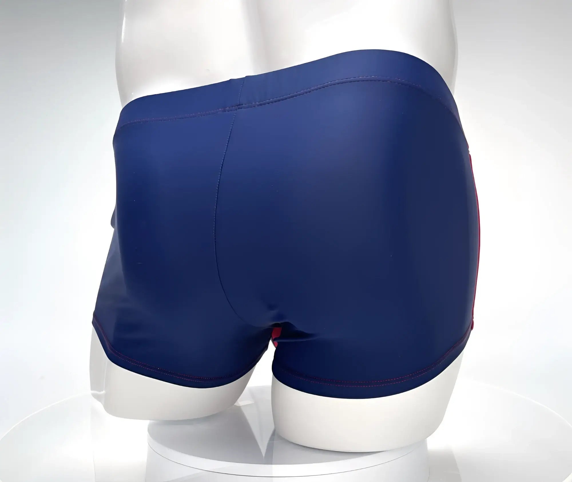 Wildmant monster cock swim square cut navy blue swim trunks with red trim along side seams for swimming