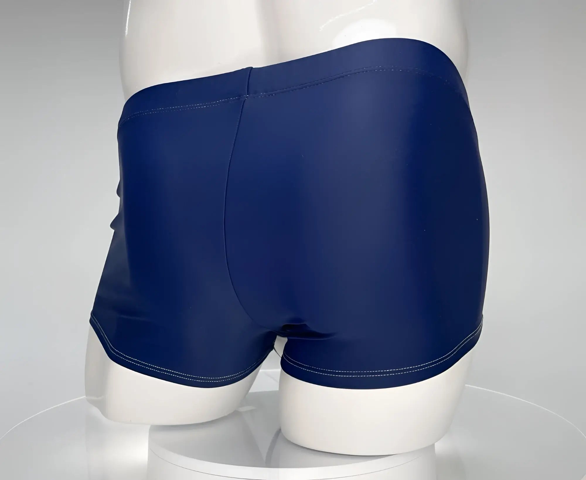 WildmanT Monster Cock swim square cut navy swim trunks with smooth glossy finish and white hem stitching
