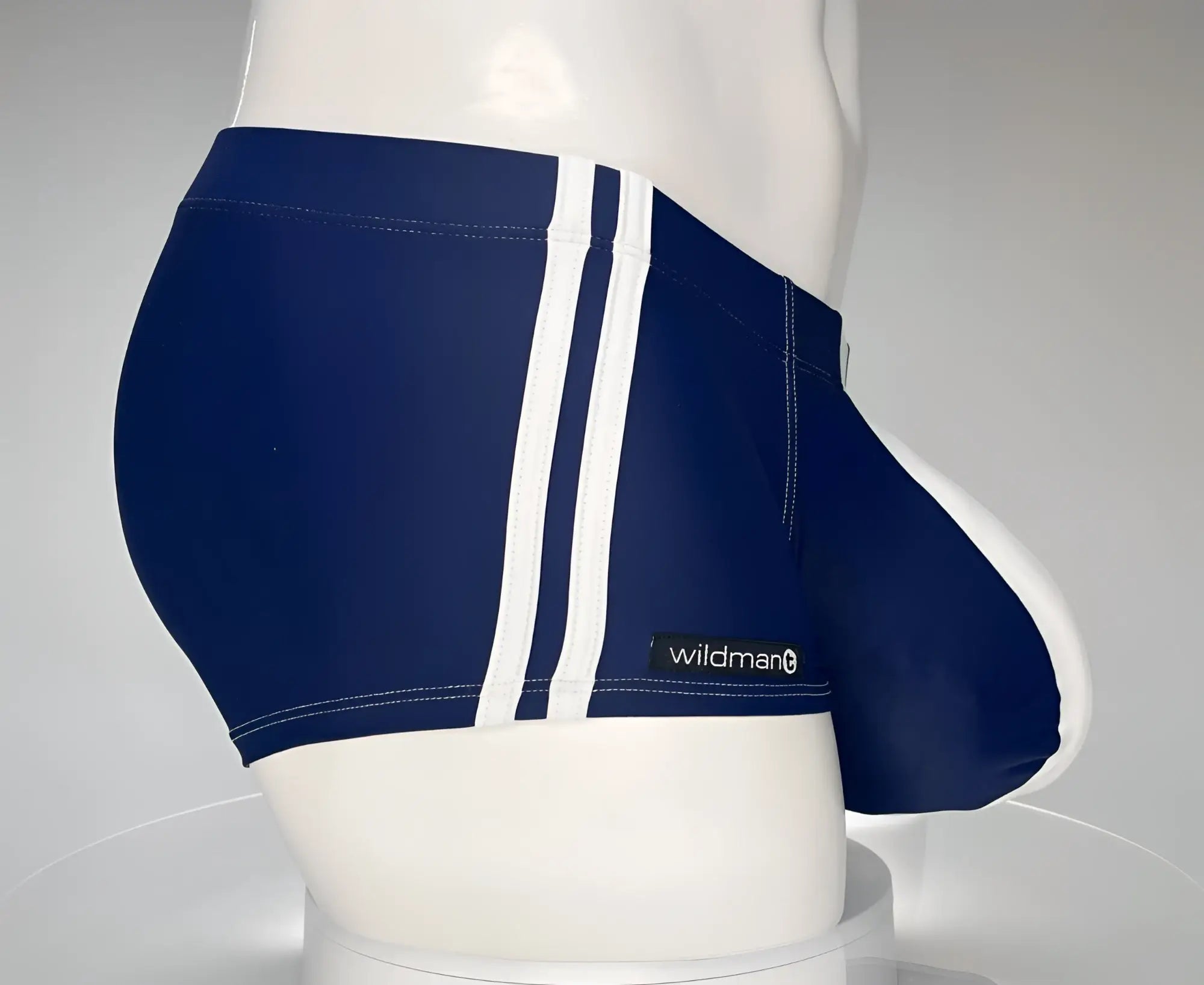 Navy blue WildmanT Monster Cock swim square cut trunks with white side stripes and Wildman brand label