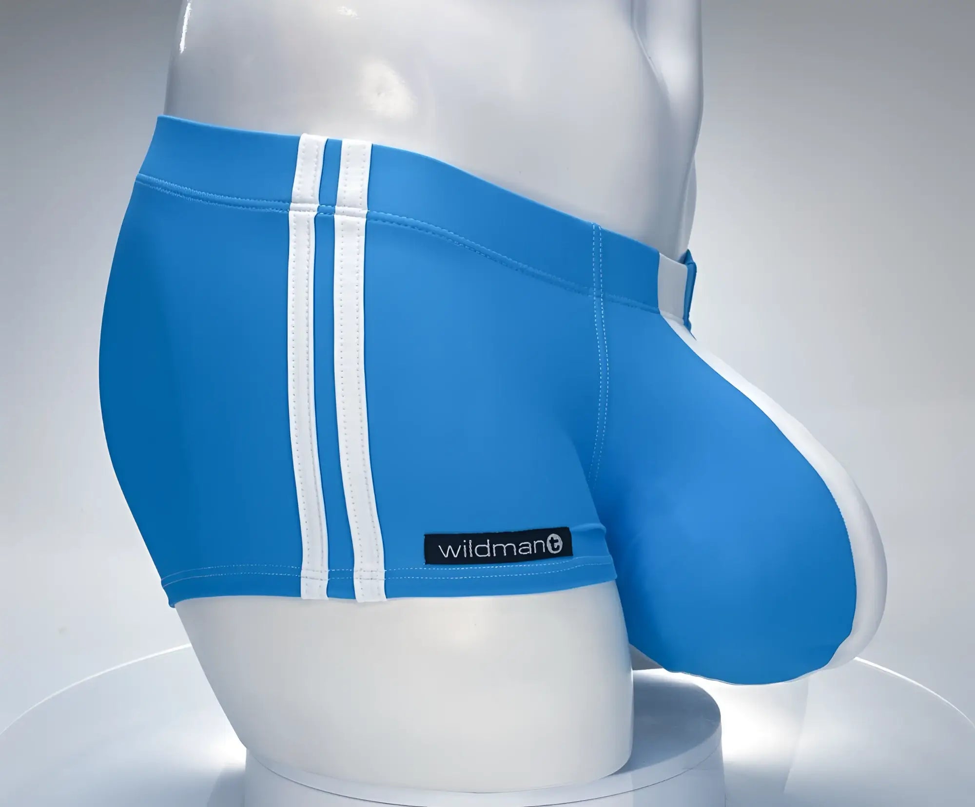 WildmanT monster cock swim square cut teal blue athletic briefs with white side stripes and wildman brand label