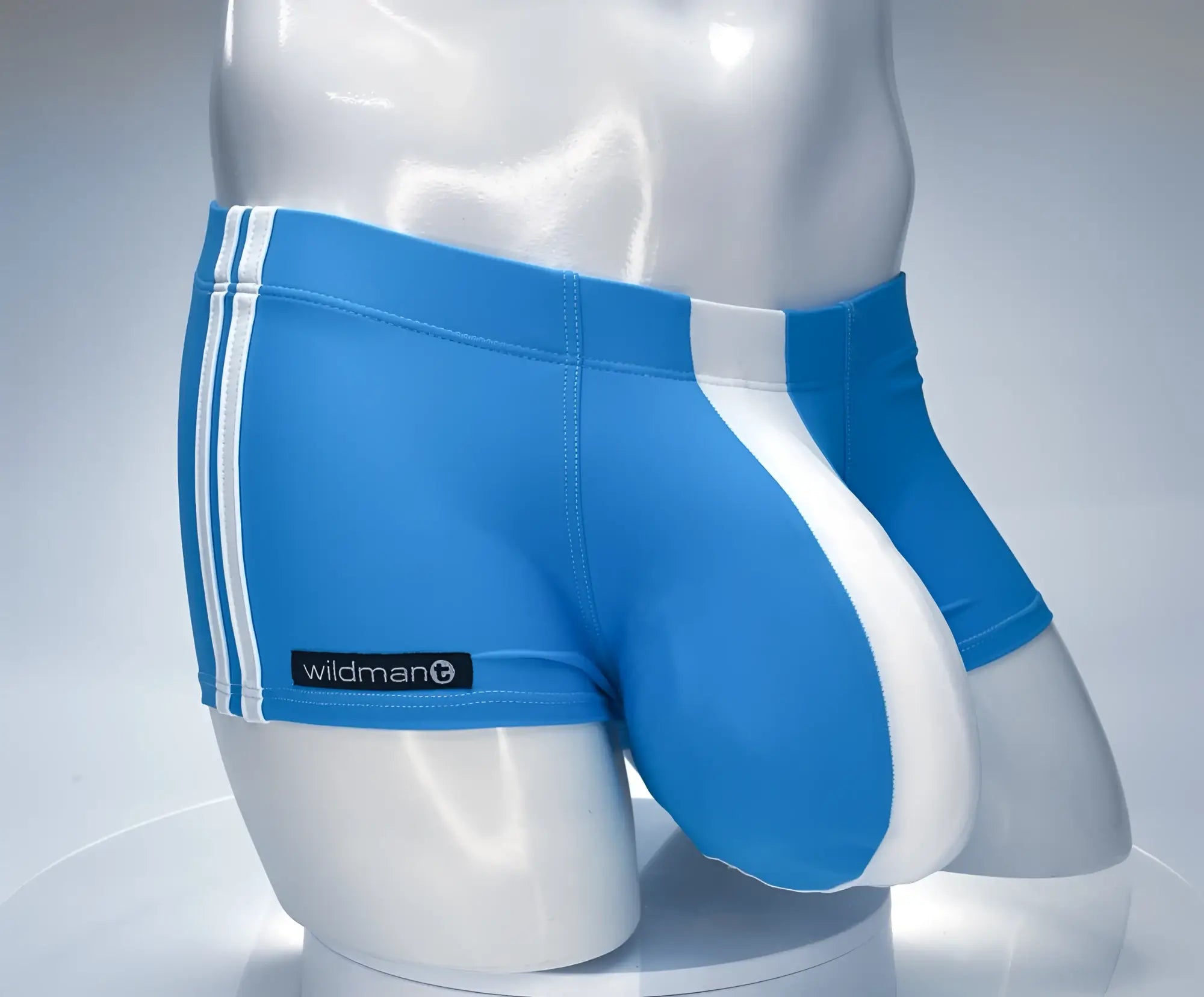 Blue and white wildmant monster cock swim square cut trunks with three stripes and branded patch in athletic style