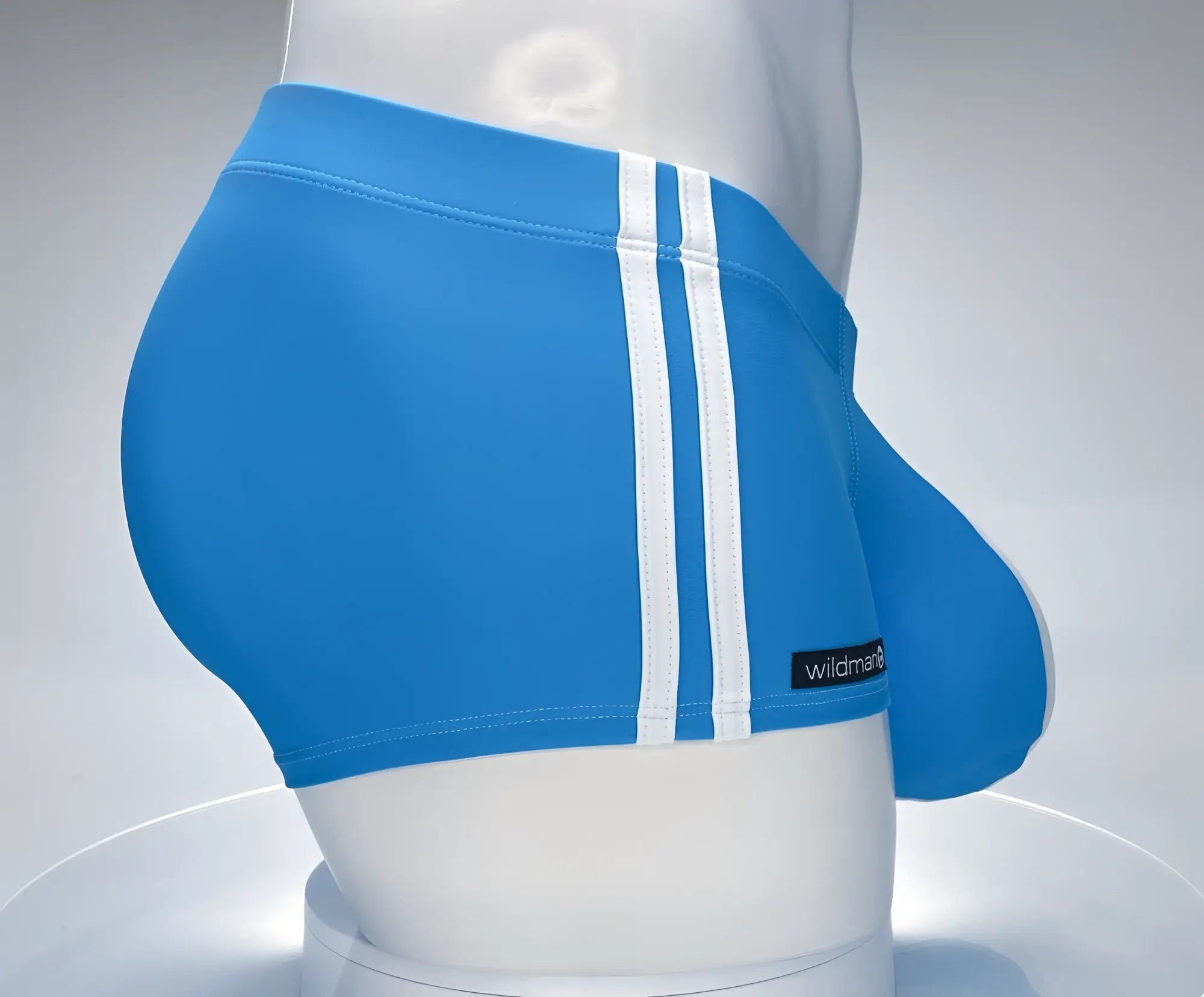 Bright blue WildmanT Monster Cock swim square cut briefs with three white stripes and black brand label on the side