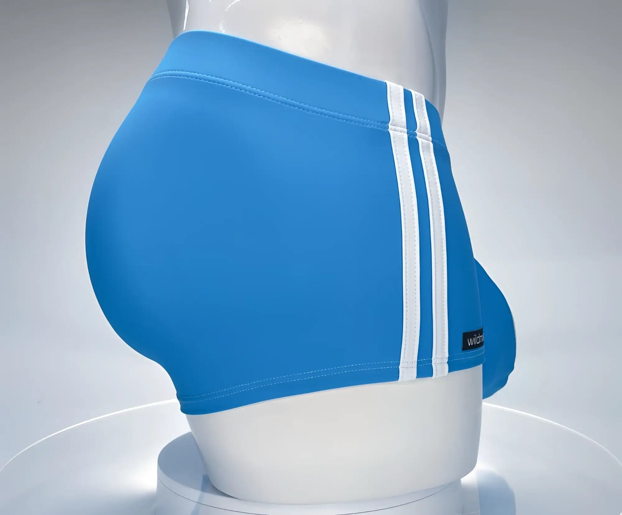 Wildmant monster cock swim square cut teal swim trunks with three white stripes and a small black brand tag