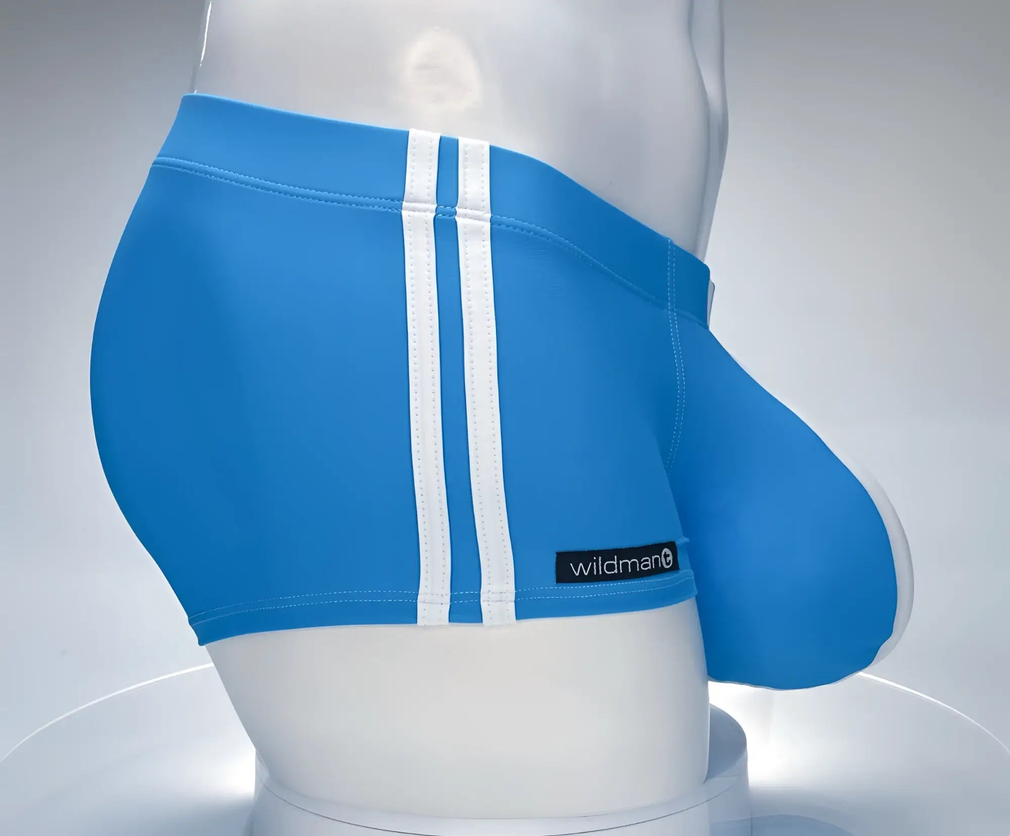 Bright blue wildman swim square cut trunks with white vertical stripes and black brand label on the side