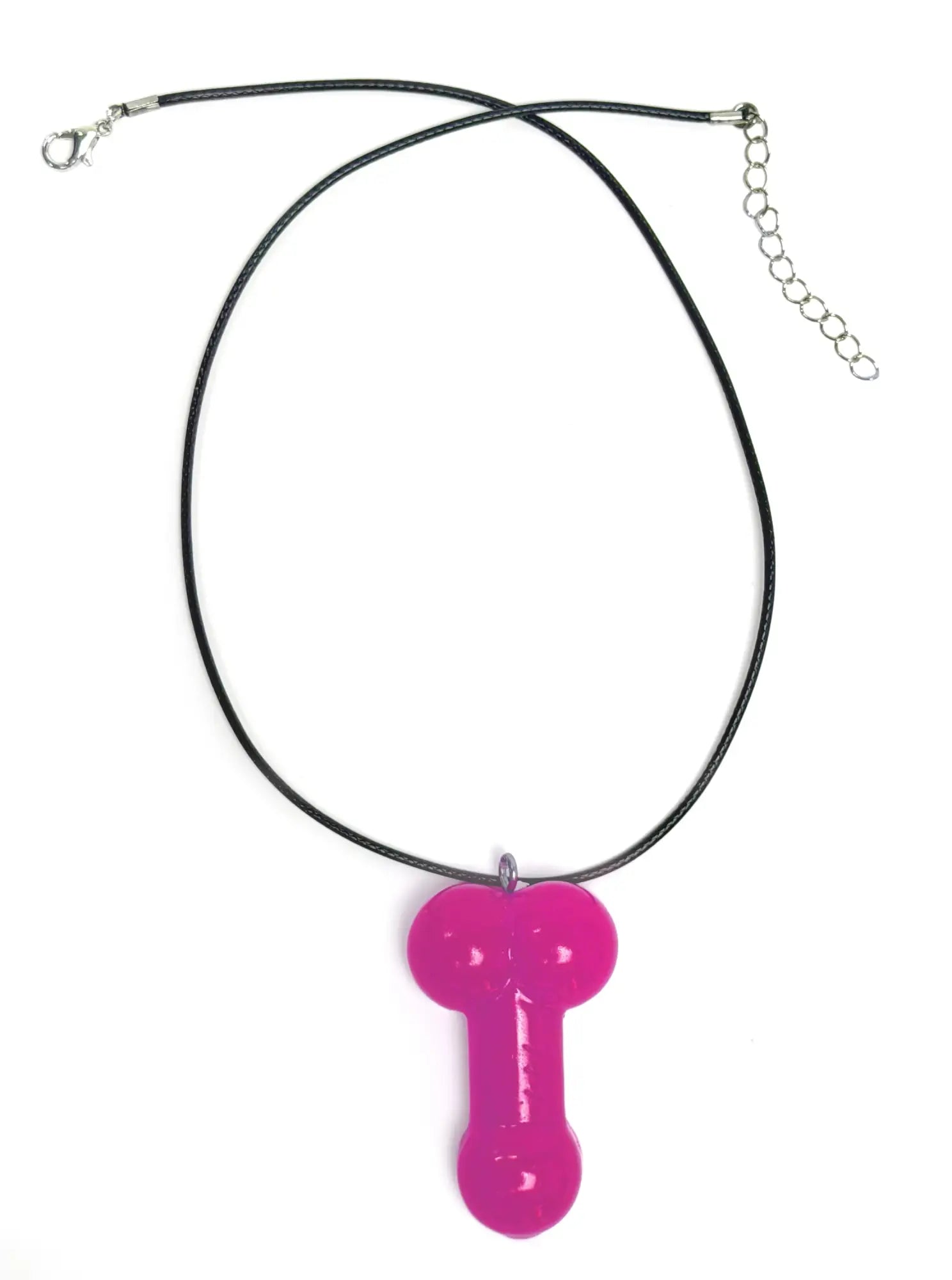 Front view of a shiny, bright pink phallic-shaped pendant on a simple black cord necklace against a white background.
