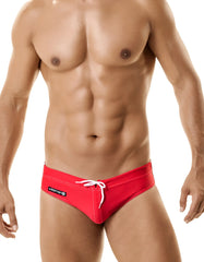 Red wildman sport bikini swim trunks with ball lifter cock ring white drawstring and black brand label on side