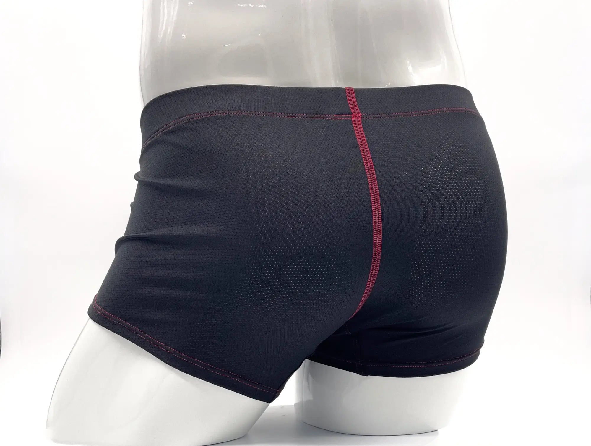 WildmanT stitch big boy pouch boxer brief in black athletic fabric with subtle mesh and red center seam stitching