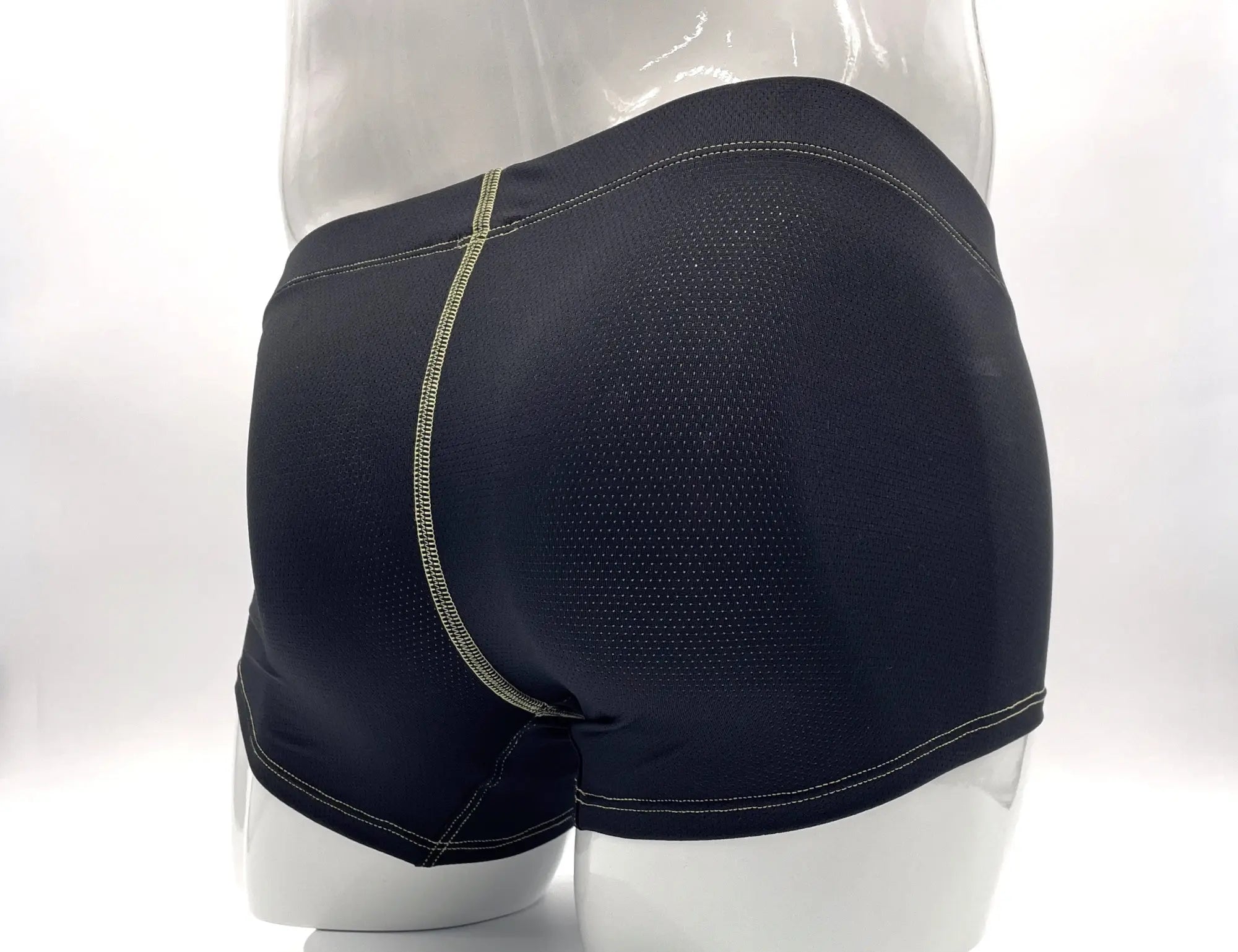 Wildmant stitch big boy pouch boxer brief in black with mesh panel and light green stitching along the side seam