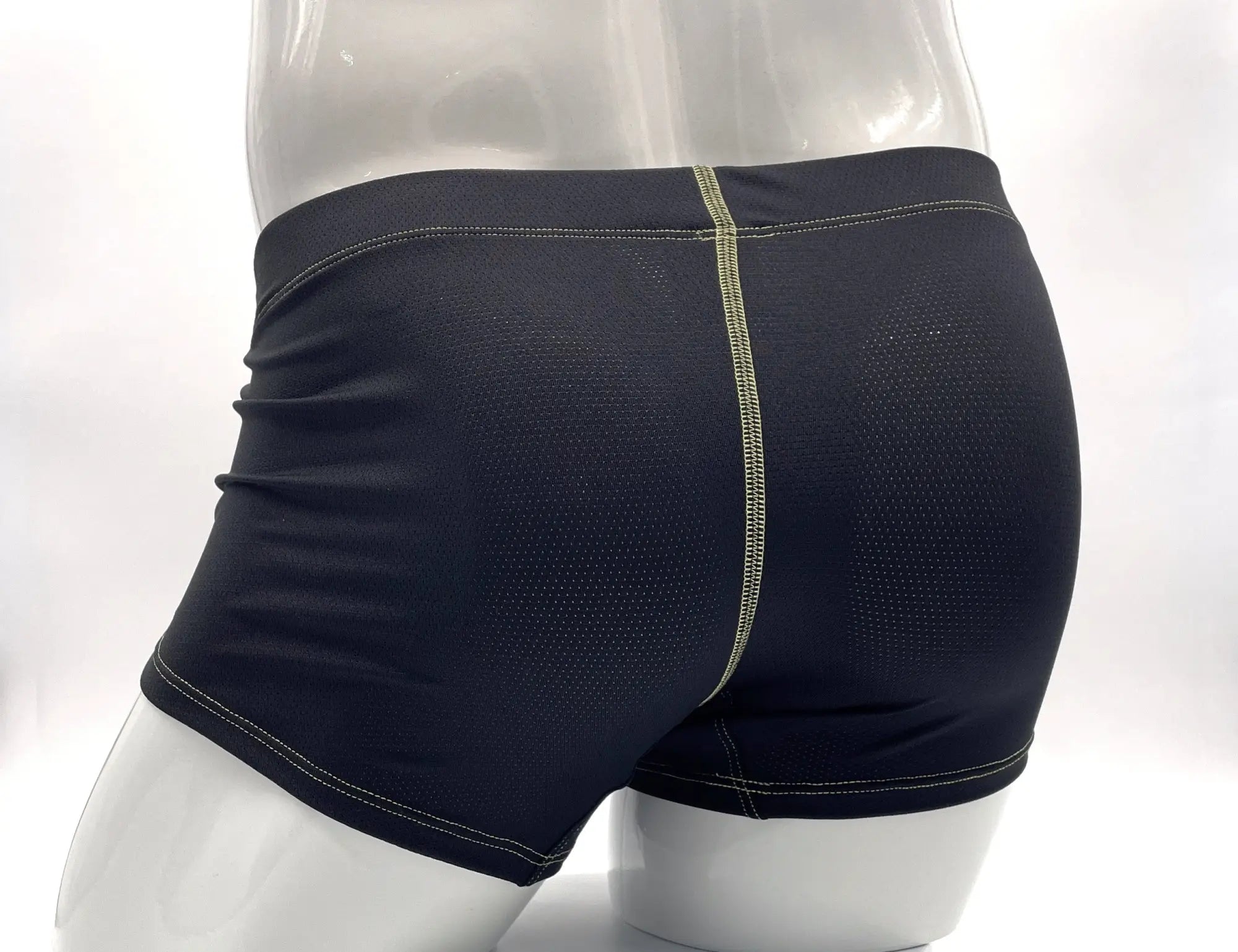 Wildmant stitch big boy pouch boxer brief yellow shown from the back in black with mesh panel and light green stitching