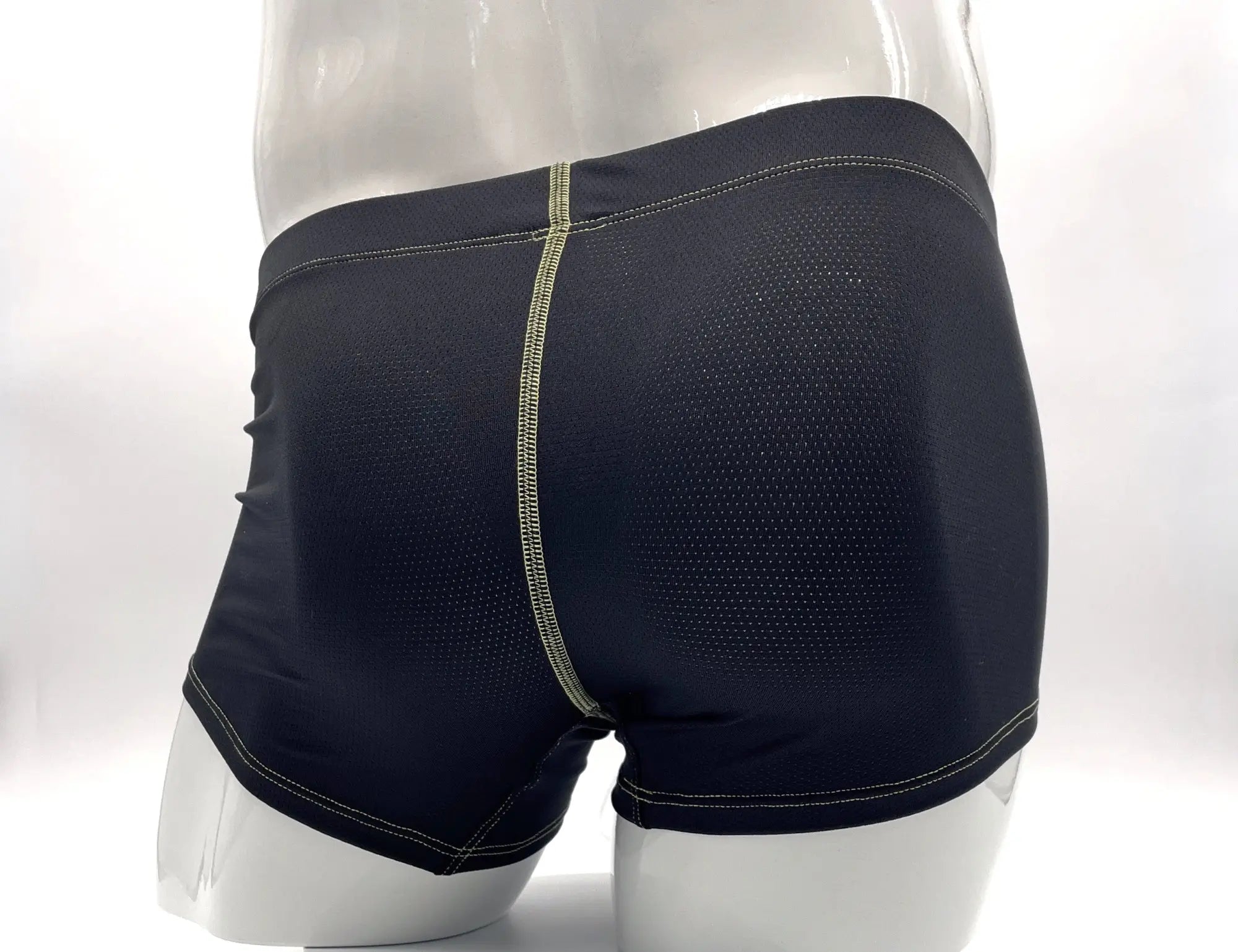 Black mesh boxer briefs with a subtle green stitching detail along the center seam.