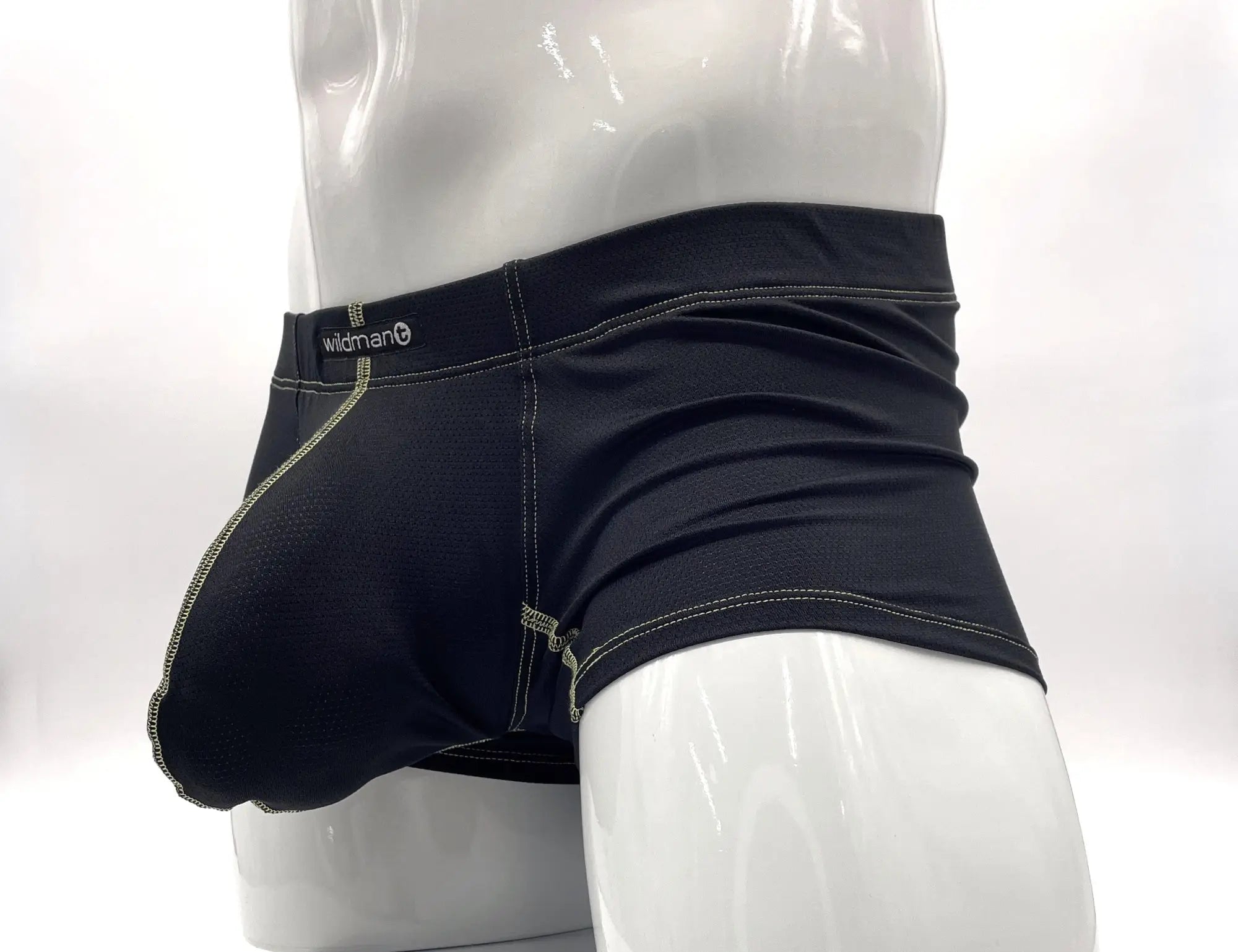 Wildman brand men’s boxer briefs in black with light green stitching featuring a snug big boy pouch design