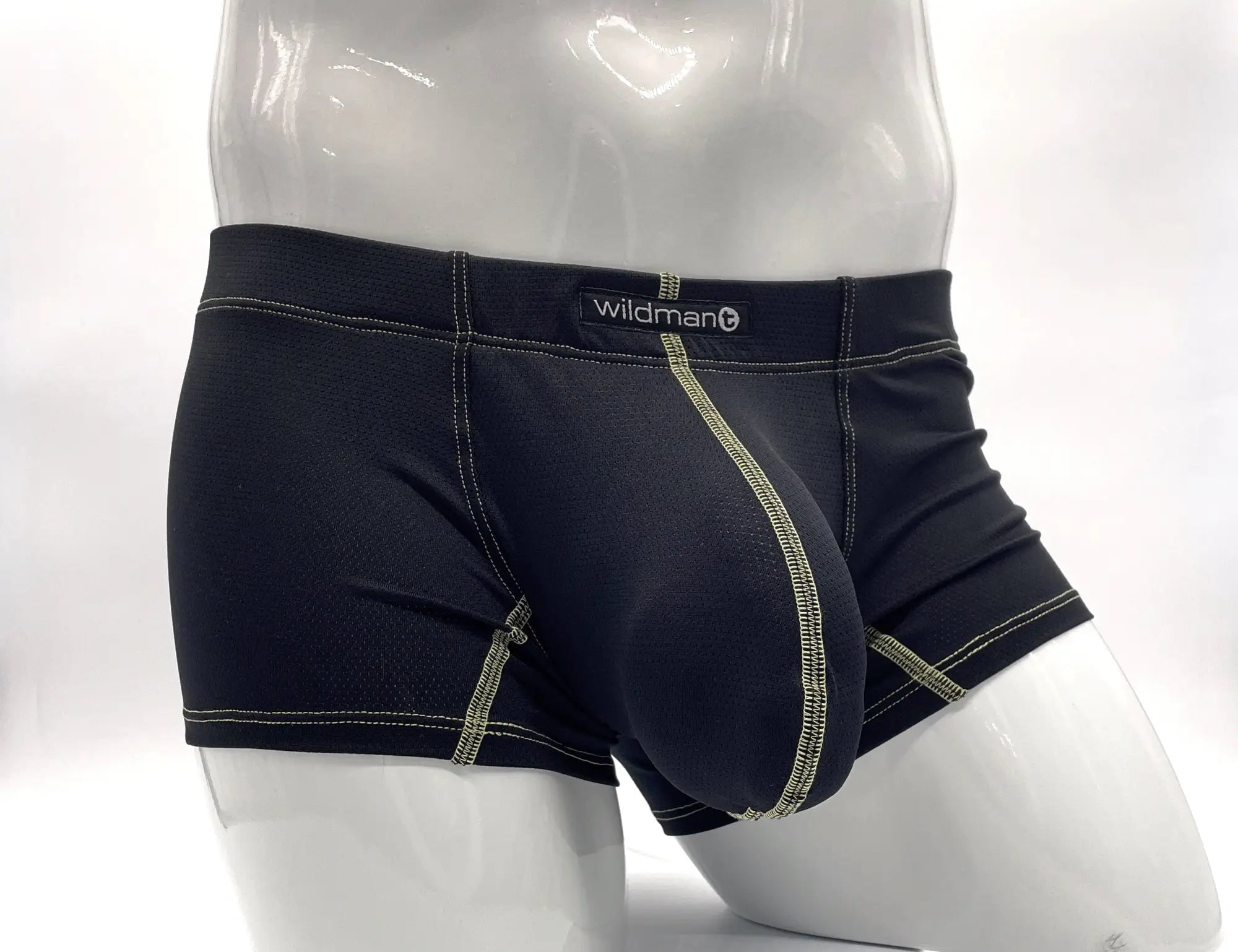 Black wildman brand men’s boxer briefs with yellow pouch, contrasting light green stitching, and contoured support design