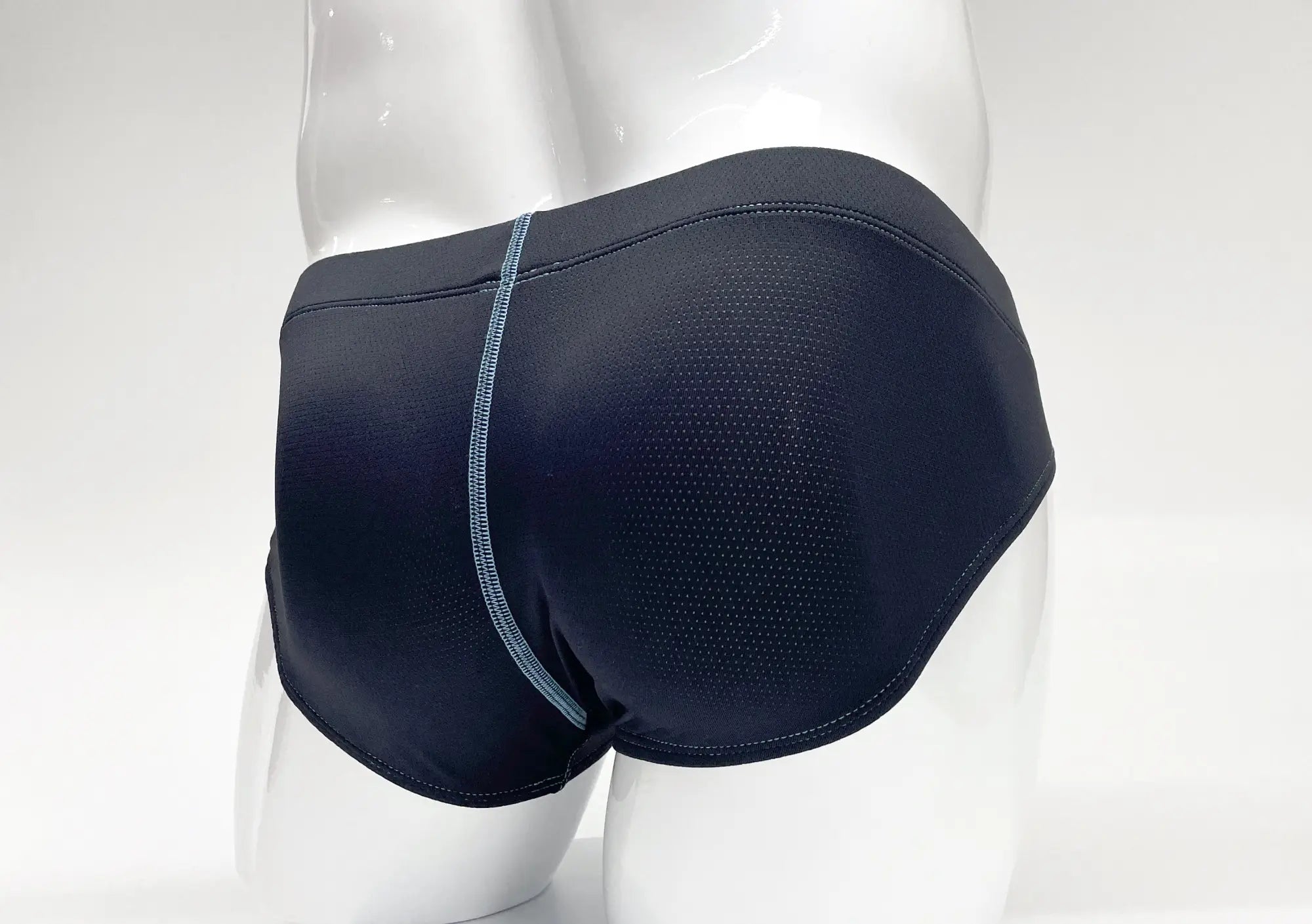 Black WildmanT Stitch big boy pouch brief with subtle textured pattern and light blue side seam stitching