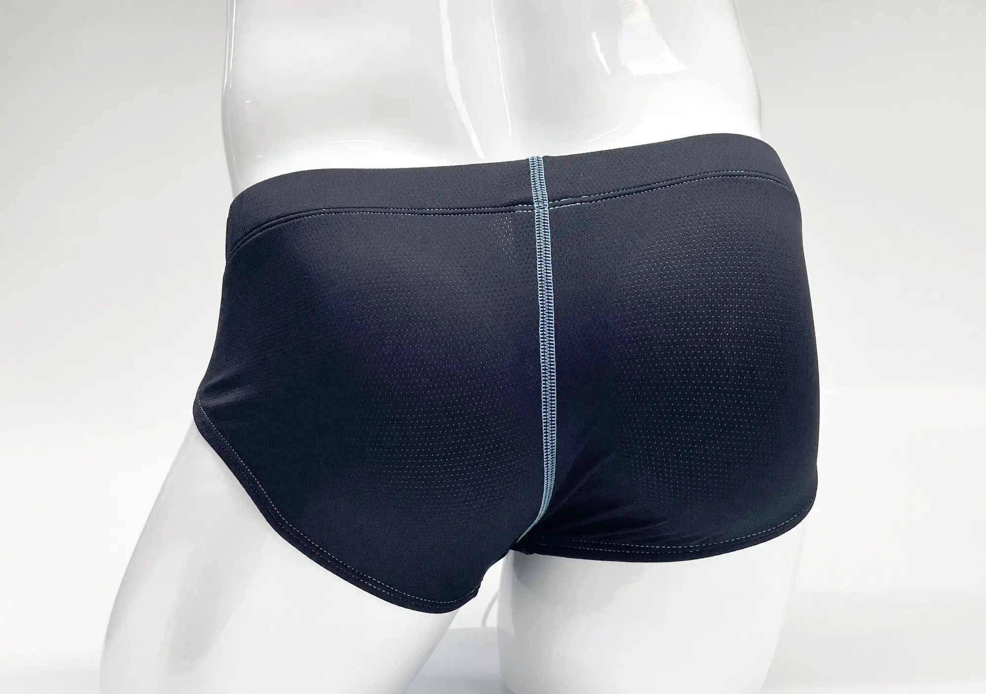 Wildmant stitch big boy pouch brief in blue with subtle textured black fabric and contrasting gray center seam stitching