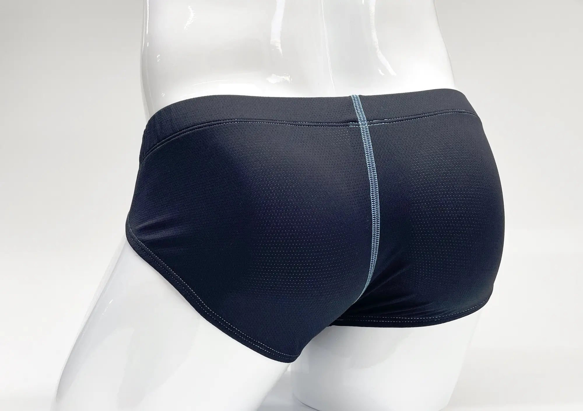 WildmanT stitch big boy pouch brief in blue with black mesh fabric and a subtle gray seam down the center front