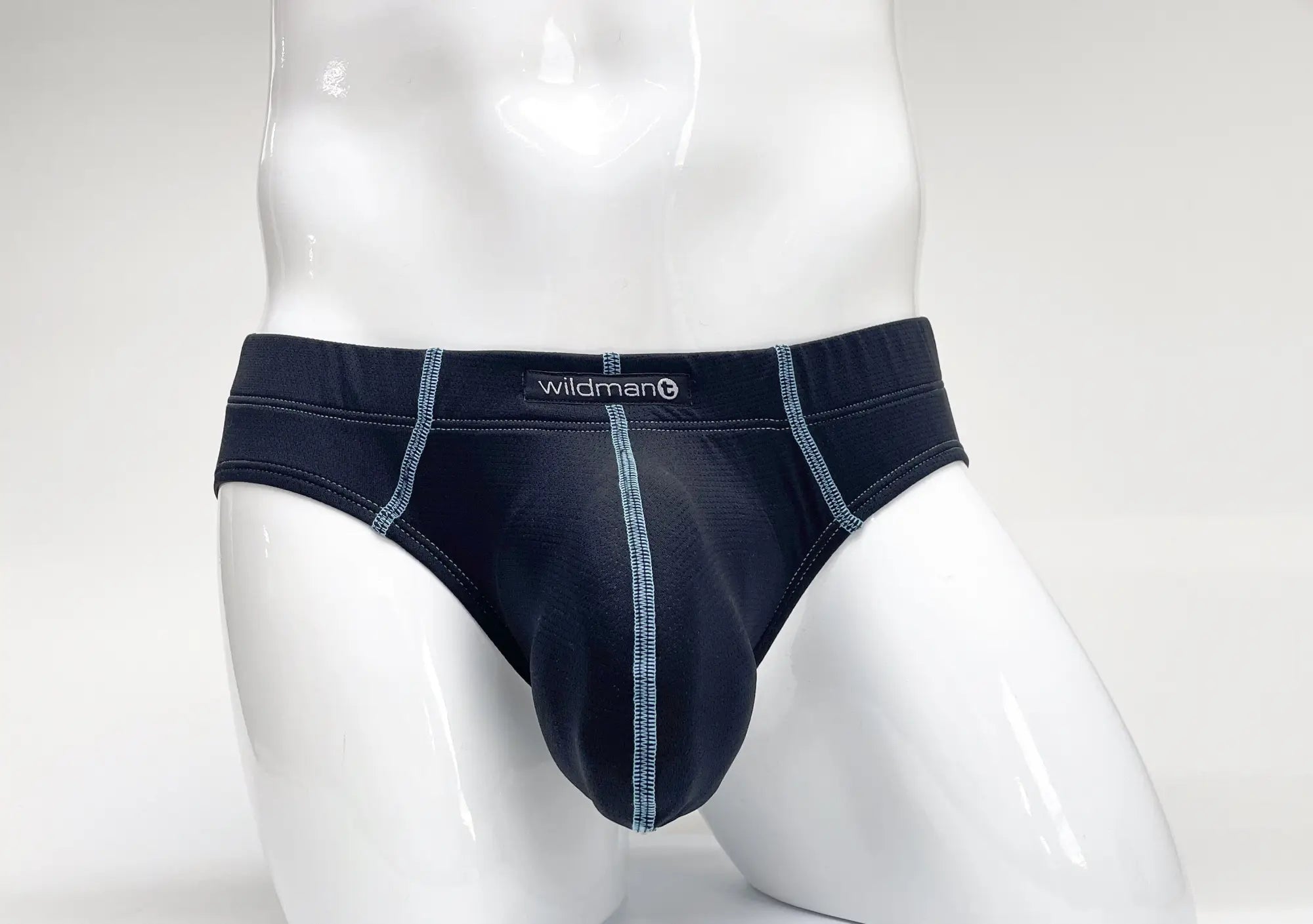 WildmanT stitch big boy pouch brief in dark navy blue with light gray stitching and wildman brand label on waistband