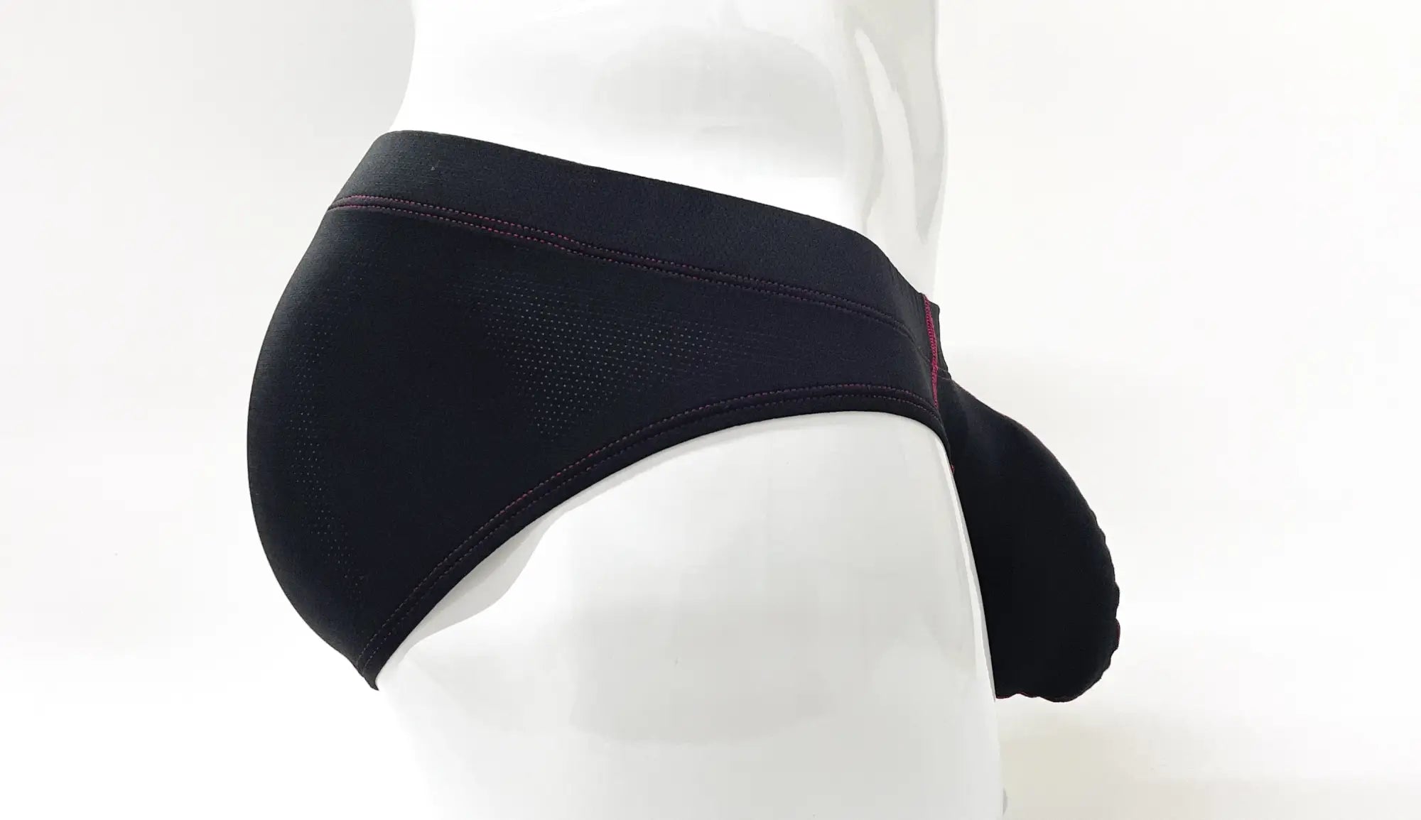 Wildmant stitch big boy pouch brief in black with textured fabric and subtle red stitching detail