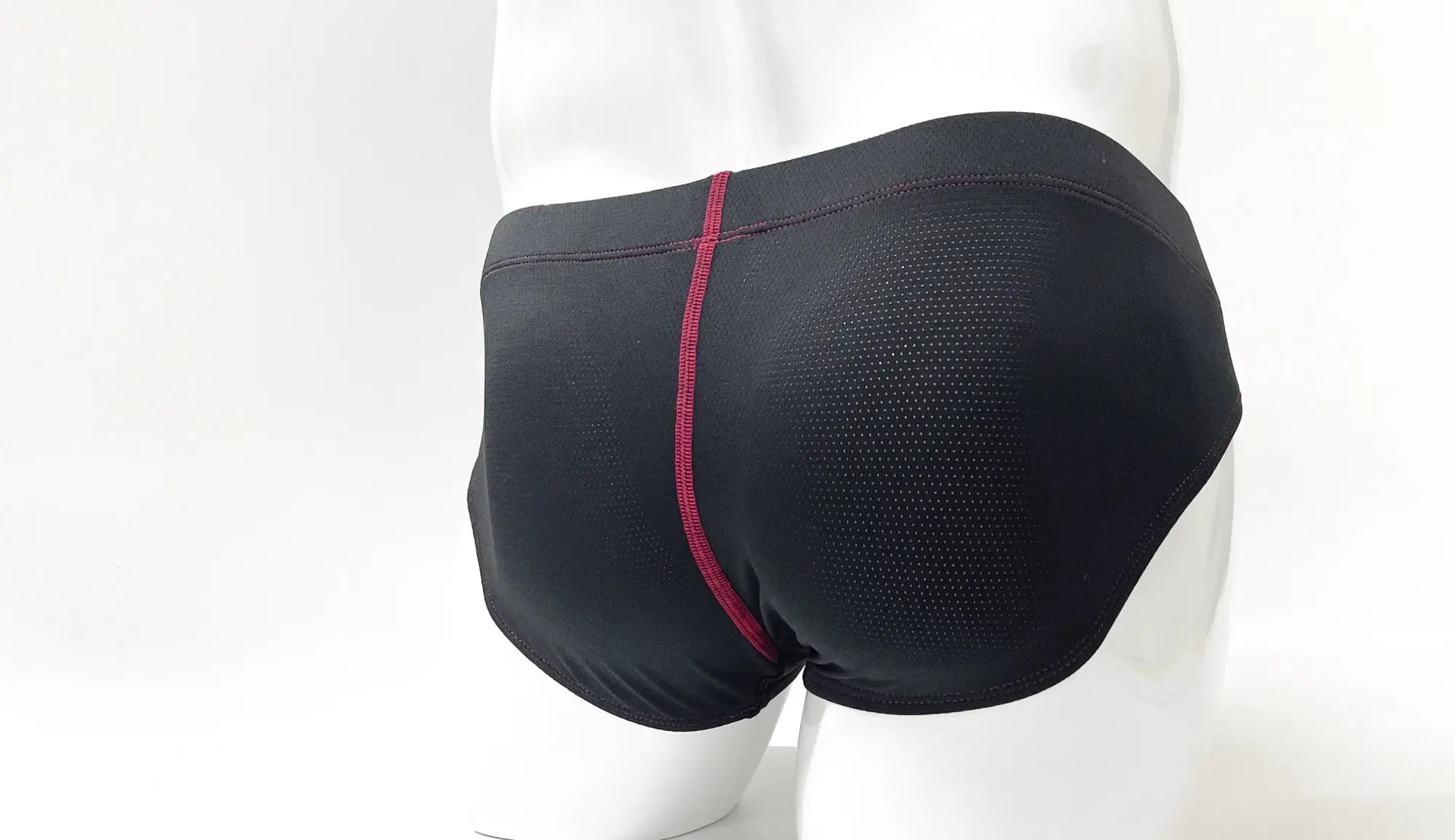 Wildmant stitch big boy pouch brief in black athletic mesh with red vertical seam for enhanced support and comfort