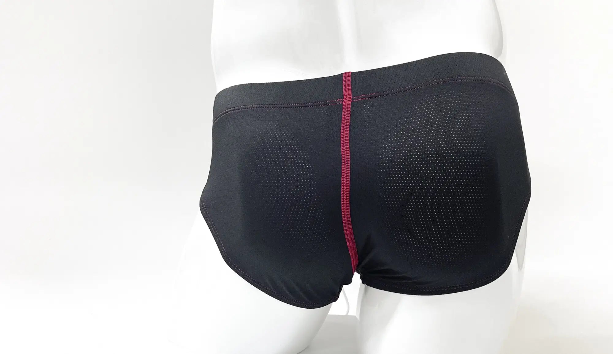 Wildmant stitch big boy pouch brief in black mesh with a red central seam designed for comfort and style